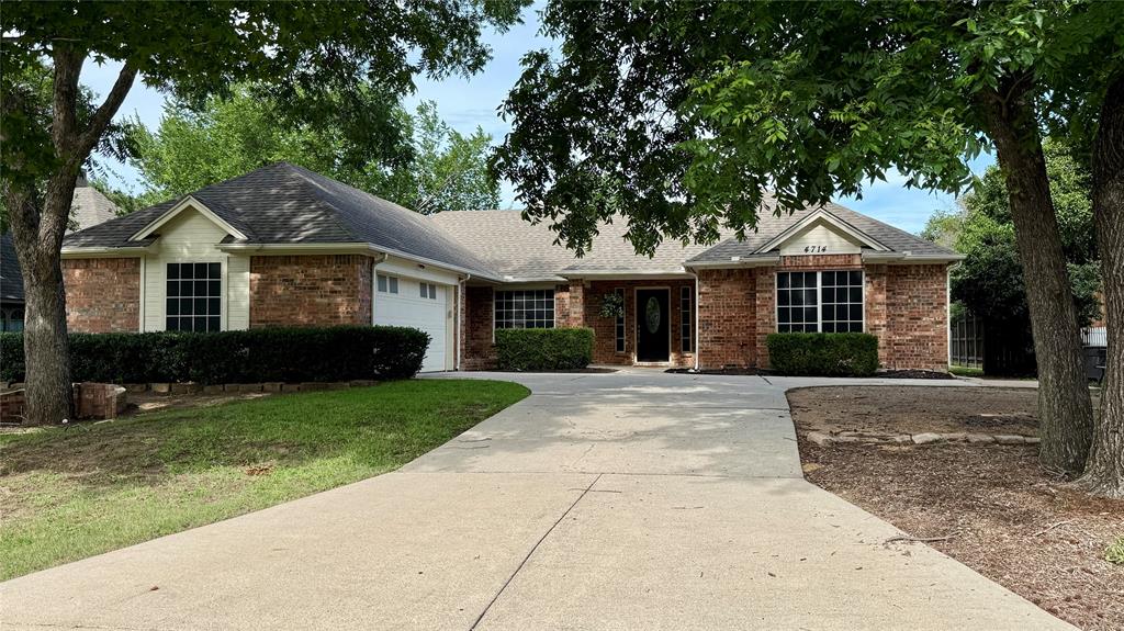 Nestled on an oversized, heavily wooded lot in one of Flower Mound’s established neighborhoods, this beautifully updated one-story brick home offers the perfect blend of charm, comfort, and convenience. Featuring 3 bedrooms, 2 baths, and a 2-car swing-entry garage, the property also includes additional parking for a boat, RV, or extra vehicles. Inside, you’ll find luxury vinyl plank flooring throughout, updated lighting and hardware, quartz countertops, stainless steel appliances, and a cozy wood-burning fireplace with a stylish limewashed limestone finish. Ceiling fans in all bedrooms add comfort year-round. The fenced backyard offers a spacious patio and storage shed, providing plenty of room for outdoor entertaining, gardening, or play. Located in a neighborhood with no HOA, a community park, mature trees, and a welcoming atmosphere where neighbors and children still enjoy the outdoors, this home offers a rare opportunity to enjoy both privacy and community in the heart of Flower Mound.