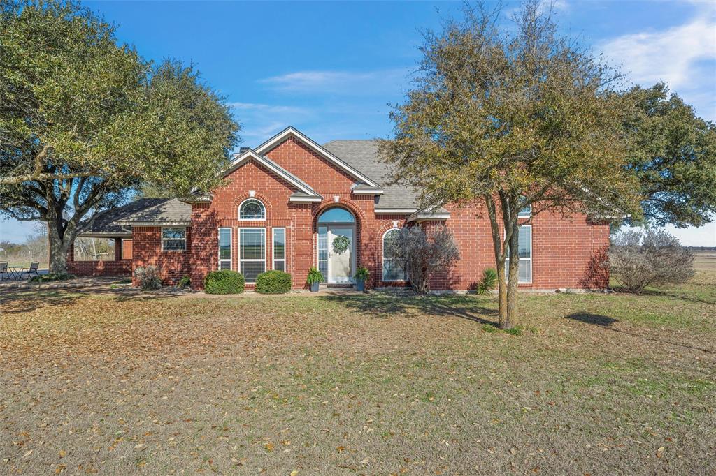 Price Improvement - Beautiful and private, this 2.04-acre property features a custom 2,988 SF home, a shop, and a separate apartment. Designed for effortless indoor and outdoor entertaining, the home offers living and dining spaces perfect for gatherings. Originally built in 1993 and thoughtfully remodeled in 2013, it includes 3 bedrooms and 3 baths with high-end finishes throughout, such as granite countertops and custom cabinetry.  Enjoy two dining areas, two living rooms, two primary suites, and a cozy wood-burning fireplace. The third bedroom provides flexible use as an office, playroom, or can function as a fourth bedroom with a closet.  The shop is equipped with water and electric and includes an apartment with its own bath—ideal for guests, hobbies, or additional workspace. An RV cover, carport, fencing, mature trees, and generous parking enhance the property’s functionality.  Located outside city limits but just minutes from highly rated West ISD schools, this home offers peaceful country living with convenient access for commuting.