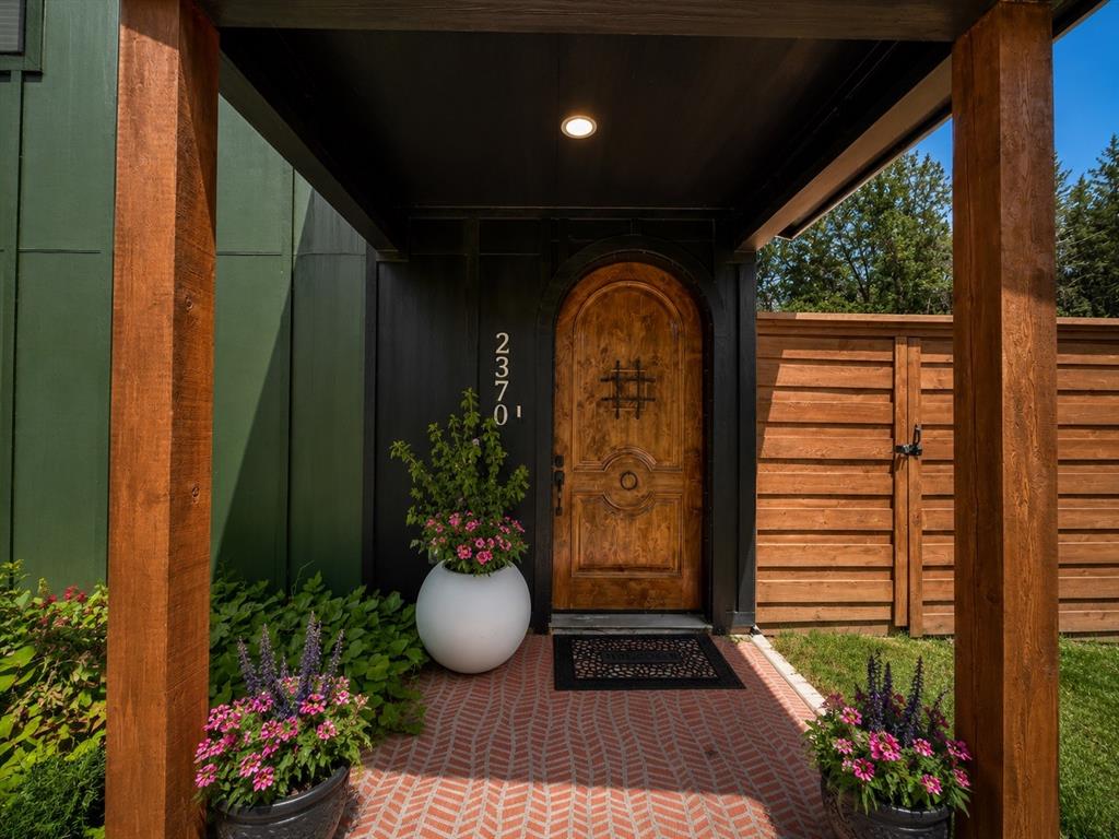 Custom home with Spanish-inspired accents, 20ft ceilings, balcony with a view, under-stairs nook, and premium woods throughout. White oak cabinetry and recessed shelves, arched alder front door, red oak stairs and shelving, and mahogany double patio door. 8ft horizontal cedar privacy fence with decorative trim, stepped panels, and an electric sliding gate. Driveway for 10+ vehicles, great for hosting.
Kitchen features: built-in pantry & utensil organization system, porcelain tile backsplash, cup rinser, and a movable rolling island with open storage and large drawer. Wall-mounted faucets in kitchen & restrooms, with a waterfall one in the guest bath. Smart, energy-efficient features: spray foam insulation, tankless WH, Nest thermostat, dimmable lights, Bosch frameless glass induction cooktop, ZLINE micro-oven combo & venthood. Mega Samsung fridge and WD included. 
The finished, insulated, air-conditioned garage offers flex space as a game room, theater, gym, or workshop. Or can be converted as additional bedrooms. The open ceiling space can also be built-out for addt'l living area.
Upstairs main suite is surrounded by tall pine tree views, smaller bedroom includes counter-bar with sink, ideal for office or guest suite, and there's a large bedroom downstairs. Landscaped yards with durable turf, decorative black gravel in walkways, and a variety of trees, plants, and herbs. French drain and mulch border in backyard. 
Approx 15 min from Downtown Dallas. Furnishings can be sold, offering convenient move-in-ready opportunity. On a road with all new homes, drawing buyers & tenants due to central location and proximity to UNT Dallas, which also attracts monthly-short-term rentals for students and professionals.
Some photos have been digitally staged-enhanced. Buyer and buyer's agent to verify all listing information, including but not limited to rooms, square footage, schools, taxes, and neighborhood. Owner financing considered with acceptable terms.