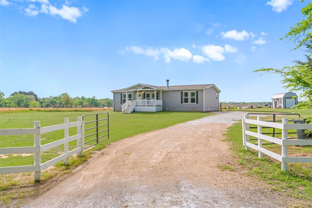 Move-in ready 3BR-2BA modular home on approximately 1.5 acres just minutes from Winnsboro. This well maintained property offers a spacious, open concept layout featuring custom kitchen with island, breakfast bar, & ample cabinetry, along with a cozy WBFP in the main living area. The split bedroom floor plan provides privacy, with generously sized guest rooms +a large primary suite that includes ensuite bath with double vanities, jacuzzi tub, walk-in shower, & walk-in closet. Additional highlights include a large utility room & pantry for added storage & functionality. Exterior features include an expansive yard with plenty of room to enjoy the outdoors & a workshop ideal for hobbies, storage, or equipment. Located in the heart of East Texas, approximately 100 miles from the Dallas-Fort Worth area and within easy access to Tyler & Longview. A great opportunity for those seeking peaceful country living with convenient access to nearby towns. Schedule your showing today.