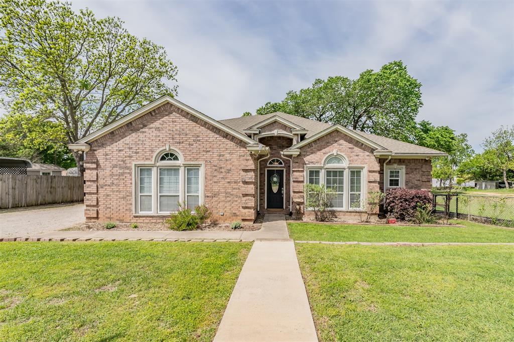 This custom built home showcases waterfront lake living. Pride of ownership is obvious, the home has been maintained and well taken care of. New HVAC units were installed 2023, new glass cooktop Mar 2026, new neutral paint throughout entire home and garage Mar 2026 and the property has an in home water softening system. Open concept floor plan with living, kitchen and dining areas all open with amazing views out to the beautiful back yard and Eagle Mountain Lake! The massive 50'x15' covered back porch is what lake living is all about, it brings indoor outdoor living to life. With access to the porch off the dining room, living room and primary bedroom you can entertain friends and family with an easy laid back flow or you can simply sit and read, nap or watch amazing sunsets over the lake! The back porch looks like a Southern Living Magazine photo and makes this waterfront property even more special. The property also has a workshop, approximately 1000sqft with concrete flooring, plumbing, electric and fully foamed insulation. The shop could be converted in another living quarter, a she shed or man cave or combo, the options are endless. Backyard has a 70'W x 4'D retaining wall at the waters edge. The backyard has a newer constructed 130 ft pier with handrail, LED lighting, with 110 and 220 electric, the perfect addition for those who love to fish. At the waters edge there is ample room if new owner chose to add a boat ramp, there is an existing 2 panel gate installed for a boat ramp. Irrigation pump system for watering front and back yard. This waterfront property has so much to offer, custom home, amazing back porch, a shop, a fishing pier, beautiful yards you need to come and see it for yourself, you may decide to make it your very own!