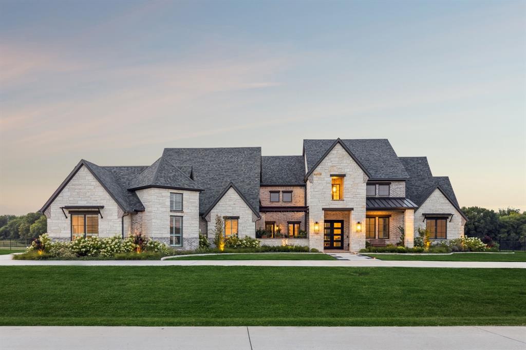Discover unparalleled elegance in Lovejoy ISD with the perfect blend of a country setting and city conveniences. Nestled on an expansive 3.42-acre private creek lot, this captivating estate offers a rare opportunity to embrace luxurious living amidst serene natural beauty. Enjoy double water views with a tree lined backdrop as you look out onto your sparkling pool and pond with multiple water features. This custom masterpiece has it all including beautiful landscaping with over 1400 plants and trees added, a circular drive and extended parking pad for guests, oversized 4 car garage, front courtyard with fireplace, garden to table dining, automatic screens to enclose the outdoor living with fireplace and infrared heaters, a cooking center with built in Blaze grill & Summit refrigerator, outdoor covered pergola for additional seating, a fire pit, hot tub, and an infrared sauna. Other notable features include a 500 sq ft media room in the basement with a Sony 4K projector onto a 160 inch screen, two large dual temperature controlled wine coolers, half bath, a dry bar and seating for 13, owned solar panels, Control 4 Tech for lights, security & thermostat, a Generac whole-house 24kV generator.  No matter what kind of weather is in the forecast, this home will keep you in comfort. The epicurean kitchen is complete with a prep kitchen, Thermador full-sized refrigerator and freezer, 48 inch commercial-grade range with two ovens, six burners, a griddle, two dishwashers, warming drawer, microwave, ice maker, and under counter wine cooler. The primary suite is sublime with a true spa-like bathroom, huge his and her closets each with an island with drawers, a captured room that is ideal for a second study, exercise room, or nursery. If you need a 5th bedroom, there are stairs that lead to a huge 2nd primary suite opportunity already plumbed and with electricity. The features and details on this one-of-a-kind residence are almost endless with a full list available upon request.