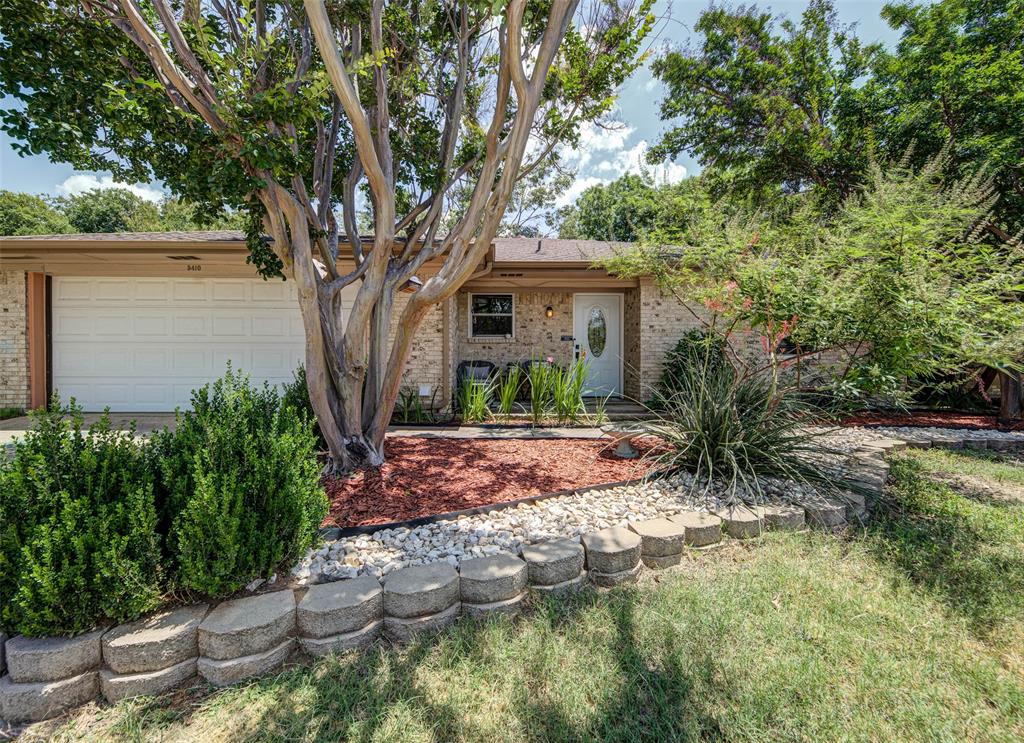 Welcome home to this charming Lake Dallas property featuring a desirable split-bedroom floor plan and outdoor spaces you'll enjoy year-round. The inviting covered front porch offers a comfortable sitting area surrounded by beautiful landscaping and mature shade trees that add character and curb appeal.

Inside, the functional layout provides privacy and flexibility, while the backyard is designed for relaxing and entertaining. A string-lighted gathering area creates the perfect atmosphere for evenings with family and friends. Pull up a chair around the fire pit and enjoy cool Texas evenings outdoors, or host cookouts and outdoor dinners on the separate patio with plenty of room for a grill and dining set.

Located just minutes from Lake Lewisville, parks, shopping, dining, and major commuter routes, this home combines small-town charm with everyday convenience. If you've been looking for a home with mature trees, outdoor living space, a split-bedroom layout, and a backyard built for making memories, this one is a must-see.

**Seller is offering a flooring concession to help make this home your own. Contact listing agent for details.**