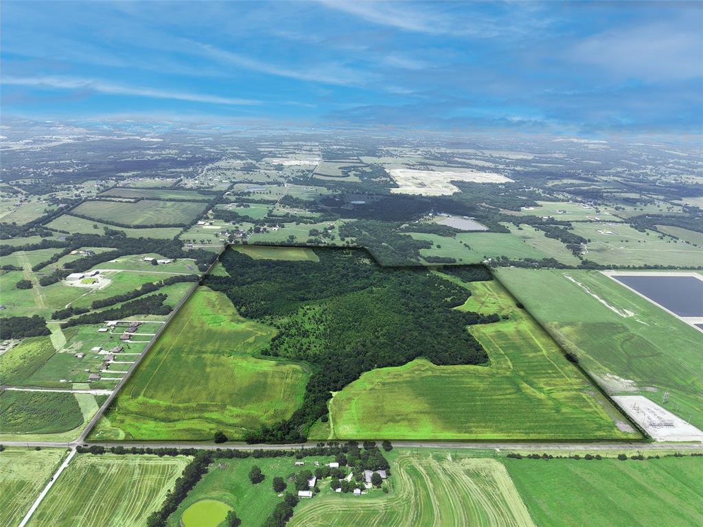 Located just ±2 miles from US-75 and outside the 100-year flood plain, this strategically positioned property sits partially within both the Sherman and Howe ETJs, offering flexibility for future growth. With traffic counts exceeding 54,000 VPD on US-75 and over 4,000 VPD on FM 902 (TxDOT 2022), the site benefits from exceptional visibility and accessibility.

Surrounded by growing residential communities and industrial developments, the property lies near Sherman—recently ranked the 4th most desirable town to live in Texas by Business Insider. Texas Instruments investing $30 billion in a new semiconductor plant and Texoma Medical Center employing over 3,000 people. Major highways in the Sherman area see traffic volumes approaching 80,000 VPD, underscoring the location’s development potential.

Water is available along the north side of FM 902.