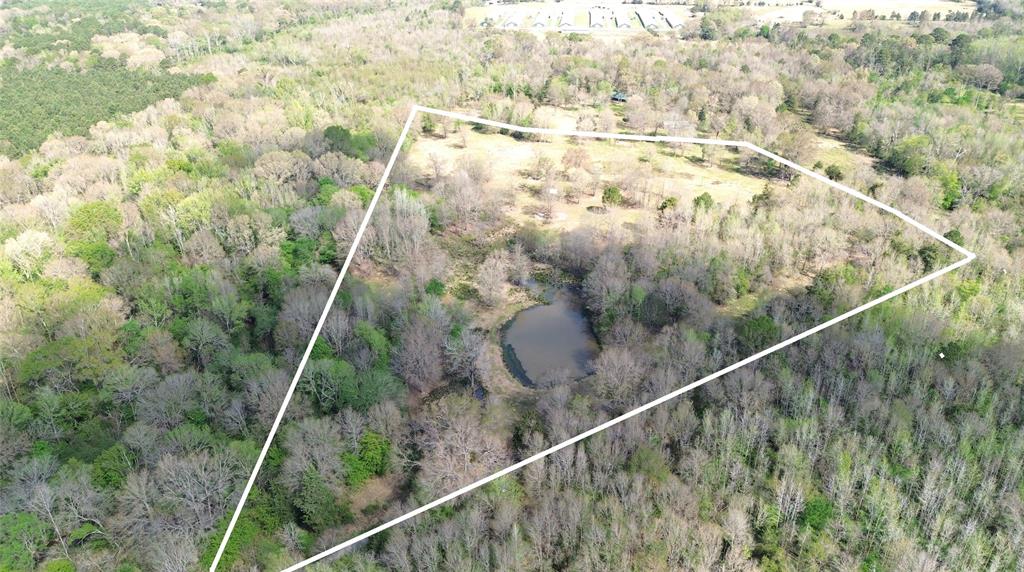 Need a privately located tract of land? Checkout these 16.41 acres with road frontage on two ends, 2 ponds, and a creek. Perfect for adream home with double access. Electric & water utilities available. No restrictions. Set your tour now!