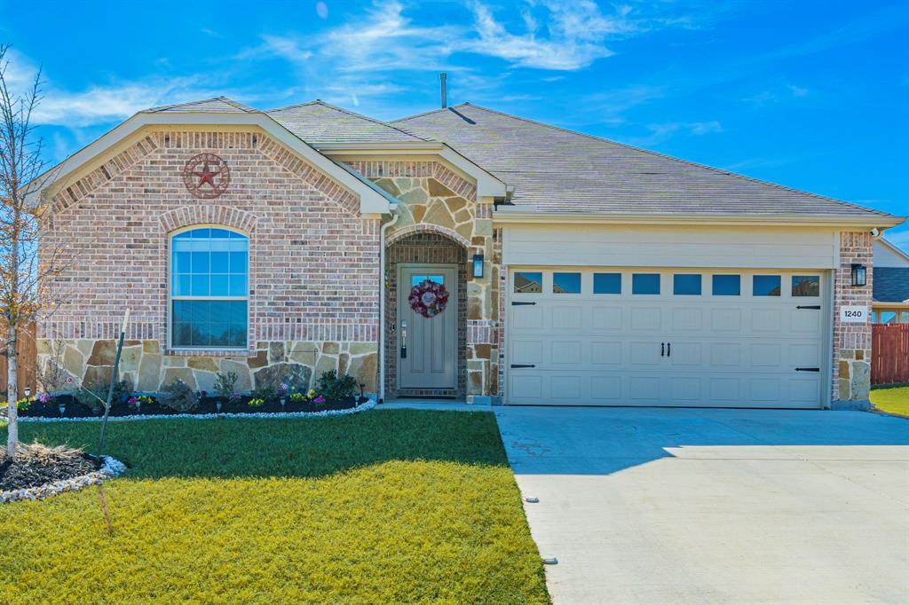 Welcome home to this beautifully built 4-bedroom, 2-bath residence completed in 2023, offering nearly 2,000 square feet of modern, single-story living in the growing Azle community. Thoughtfully designed with an open-concept layout, this home is perfect for both everyday living and entertaining.
The spacious kitchen flows seamlessly into the breakfast area and main living area, creating a natural gathering space for family and friends to sit around the custom electric fireplace. A separate dining room makes for a great place to host holidays and family get togethers.  Generously sized bedrooms provide flexibility for a home office, guest room, or playroom, while the private primary suite offers a relaxing retreat with a spacious ensuite bath.
Situated on a larger corner lot of approximately 10,000 square feet, the fully fenced in backyard offers expansive room to enjoy outdoor living, pets, or future customization. A 2-car garage adds everyday convenience, and the newer construction means energy efficiency and low maintenance for years to come.
Located in Azle ISD with easy access to shopping, parks, dining, major roadways, and close proximity to Eagle Mountain Lake, this home delivers a strong blend of modern comfort, space, and location in a beautiful community.