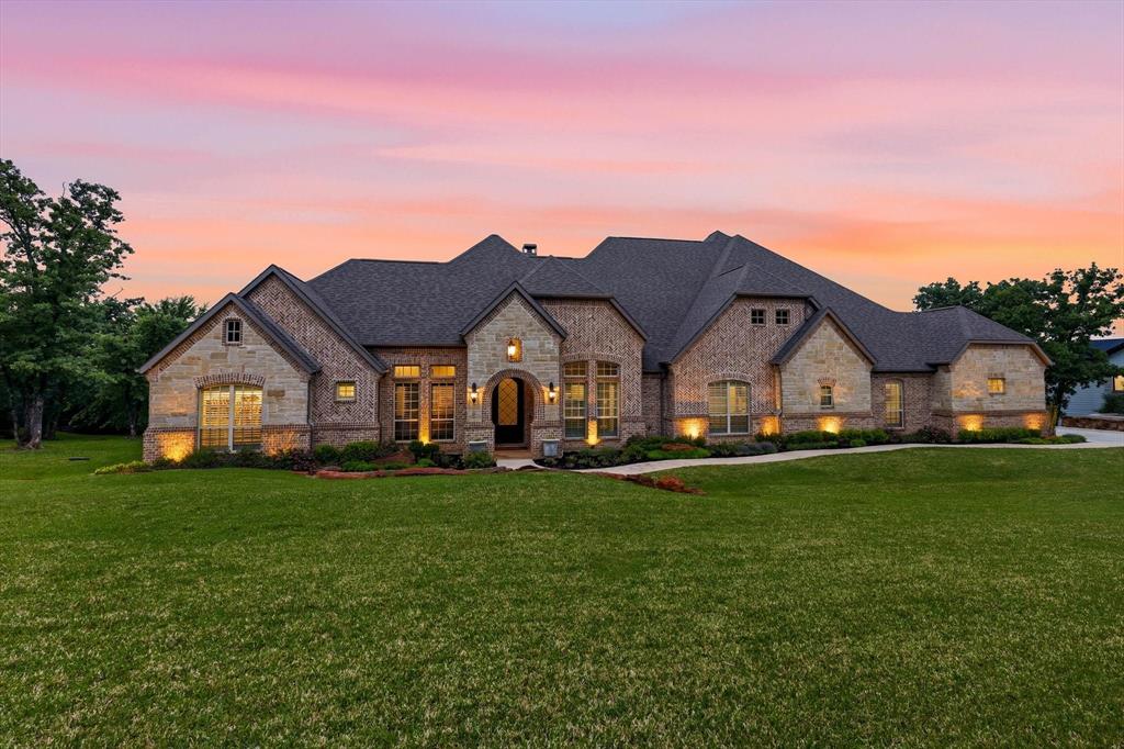 Step into unparalleled elegance with this breathtaking luxury residence, where timeless design meets modern sophistication. Nestled in a prestigious setting, this exquisite home showcases impeccable craftsmanship, soaring Cathedral ceilings, and expansive living spaces bathed in natural light. From the moment you enter, you’re greeted by a grand foyer that flows seamlessly into refined formal dining and casual living areas—perfect for both intimate gatherings and lavish entertaining. The gourmet chef’s kitchen is a masterpiece, featuring top-of-the-line appliances, custom cabinetry with upper and lower lighting, and an oversized island that serves as the heart of the home. Retreat to the opulent primary suite, a private sanctuary complete with a spa-inspired bath, soaking tub, dual vanities, and an incredible walk-in closet. Three additional bedrooms with ensuite baths offer comfort and privacy, each thoughtfully designed with high-end finishes. This home features an expansive game room complete with a full bar, perfect for entertaining. In addition, enjoy a fully-equipped media room designed for an immersive viewing experience—perfect for movie nights, sports events, or relaxing with family and friends. Step outside to the expansive backyard patio, where beautifully landscaped grounds and mature trees surround a cozy fireplace, outdoor kitchen, and multiple lounge areas—ideal for enjoying serene mornings or unforgettable evenings. Three-car garage with epoxy flooring and stairs to additional storage space - PLUS spray foam insulation! Every detail has been carefully curated, from designer lighting to premium materials, creating a home that exudes sophistication, comfort, and exclusivity.