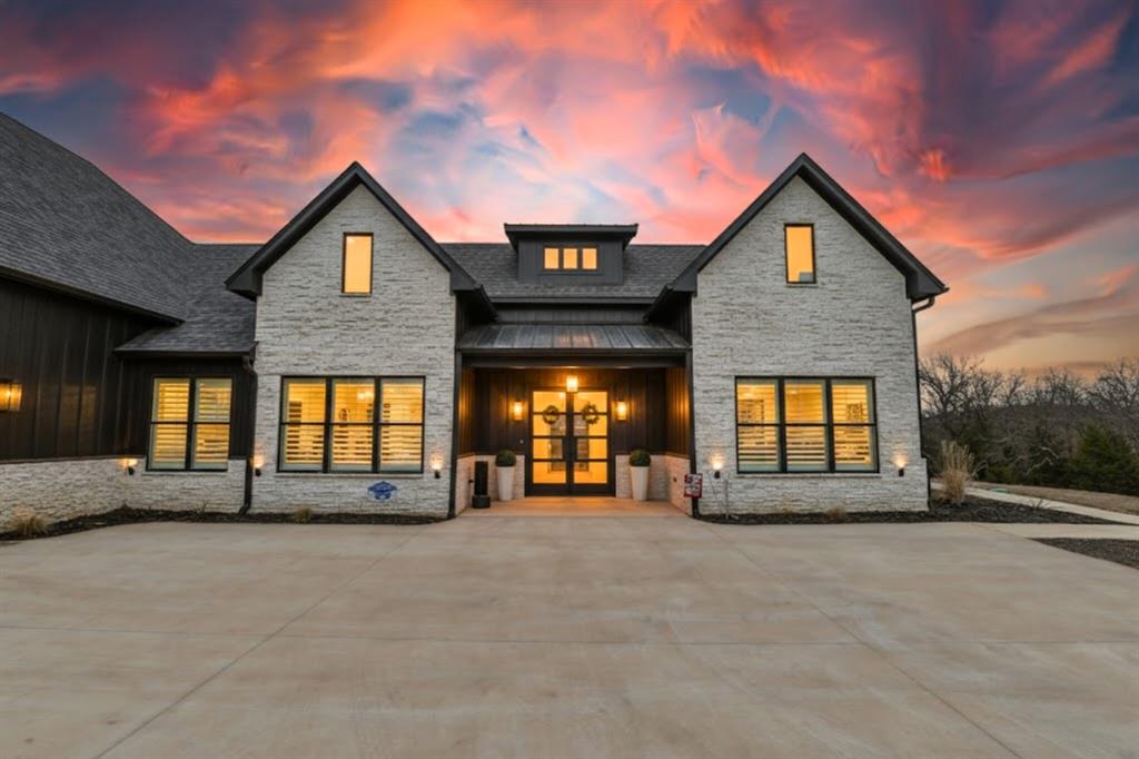 Luxury estate on 6 acres in Lindale ISD, thoughtfully designed with exceptional upgrades throughout. This 2022 built custom home offers 4 bedrooms, each with a private en-suite bath, plus 2 additional half baths. A dedicated office with closet provides flexibility for a 5th bedroom. The primary suite is a true retreat, with vaulted ceilings, a fireplace, and the bathroom featuring heated bathroom floors and a stunning wet room with extra large soaking tub. The Chef's kitchen has floor to ceiling custom cabinetry, a double oven with professional grade appliances, a huge walk in pantry, and large pass thru window to the patio. The living room has 18 ft vaulted ceilings, a Venetian plaster firelplace that mirrors the custom ventahood, and large dining room complete the entertaining space. The primary suite, office, and laundry are all on one side of the house making privacy a breeze. The second floor features a professionally designed home theater with specialty sound equipment, a private workout room, loft area, and an additional half bath. Outdoor living is equally impressive with a resort-style pool, diving board, tanning deck, hot tub, expansive patio, and fire pit, all overlooking a stocked pond. A whole home generator keeps you online even when the power is off! Equestrian and livestock amenities include a 3-stall barn with custom stalls, automatic waterers, power to each stall, full fencing and cross-fencing, and water run to each pasture section. A rare combination of luxury living, recreation, and acreage all in award winning Lindale ISD. Quick and easy access to I20 and loop 49 make this the dream for any commute!