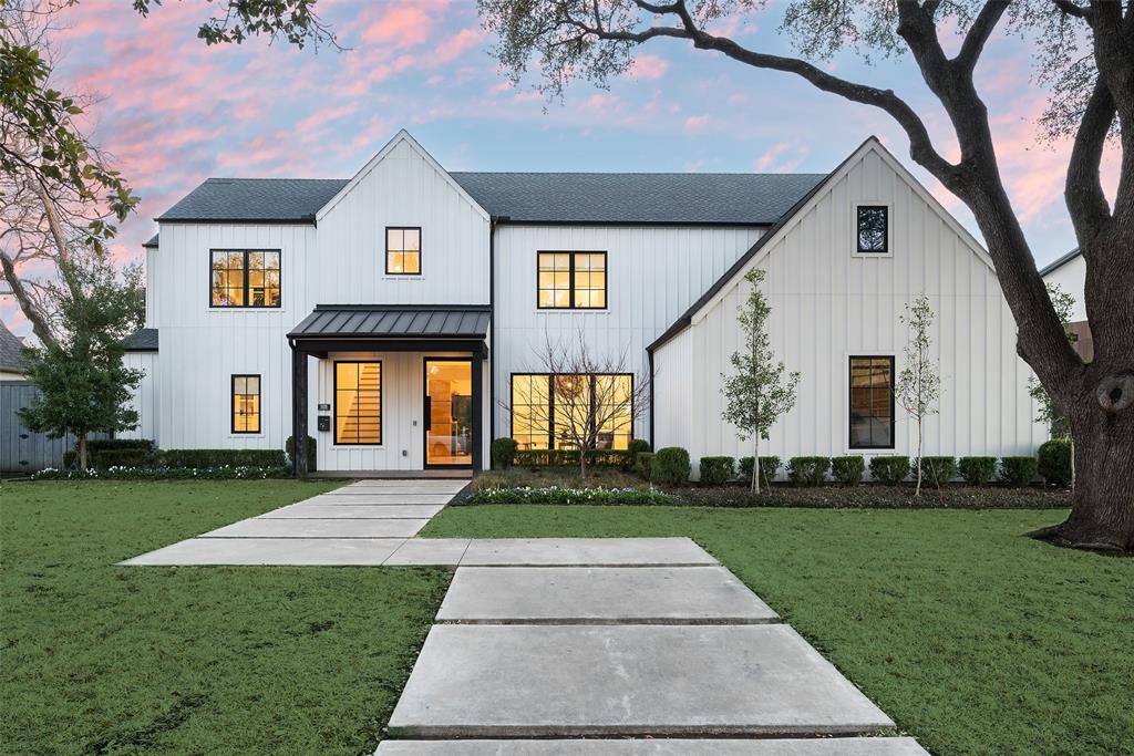 Built by high-end luxury builder, Platinum Homes by Mark Molthan, this exquisite modern farmhouse in Preston Hollow with a wide 105 ft lot allows for an expansive downstairs floor plan, including two large living areas, two offices and the primary suite.  In the heart of the home, the gourmet kitchen featuring Wolf and SubZero appliances opens to the main living with cathedral ceilings, a wet bar, breakfast room, second living area or downstairs game room – all overlooking the covered patio, turfed yard and incredible pool and landscaping.
The downstairs primary suite is a true retreat, flooded with natural light and offering a serene space for rest and relaxation. It’s complete with a luxurious bathroom, large walk-in closet, and premium finishes throughout.
Upstairs, you’ll find four generously sized ensuite secondary bedrooms, each offering walk-in closets and private baths. The game room or media room provides the ideal space for family entertainment or relaxation. Whether it’s Lego days or movie nights, this room adds to the home’s versatile appeal.
The outdoor space is equally impressive, with a sparkling pool and spa perfect for relaxing or entertaining. The covered patio provides a shaded area for al fresco dining, and there’s plenty of turfed space for play and leisure.  The 3-car garage is accessed from Caladium creating a terrific hard surface play area.
Located close to major travel arteries, this home is within easy reach of Dallas’s most sought-after private schools, two major airports and world-class shopping and dining options.