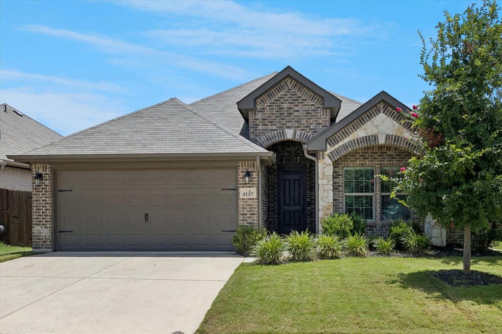 Welcome to this beautifully maintained 3-bedroom, 2-bath home offering 1,735 square feet of stylish, open-concept living in the desirable Rosemary Ridge community. Built in 2019, this move-in ready home combines modern finishes with a functional floor plan designed for everyday living and entertaining. Step inside to find beautiful wood-look tile flooring that flows throughout the main living areas, creating a warm and inviting atmosphere. The spacious living room features soaring ceilings, abundant natural light, and seamlessly connects to the kitchen and dining area, making it the perfect space for family gatherings and entertaining guests. The kitchen is truly the heart of the home, featuring gorgeous granite countertops, stainless steel appliances, a large breakfast bar with plenty of seating for barstools, an abundance of cabinet and counter space, and a walk-in pantry that provides exceptional storage. The adjoining dining area is filled with natural light and overlooks the backyard. Privately situated away from the secondary bedrooms, the spacious primary suite. The luxurious ensuite bath features dual vanities, a relaxing garden tub, separate walk-in shower, tile flooring, and a large walk-in closet. The thoughtfully designed split-bedroom floor plan offers privacy for everyone, with two generously sized secondary bedrooms and a full guest bath located on the opposite side of the home. Step outside to enjoy the covered back patio, The fully fenced backyard provides plenty of space for children, pets, gardening, or outdoor entertaining. Conveniently located near schools, parks, shopping, restaurants, and major highways, this exceptional home offers the perfect blend of comfort, style, and convenience.