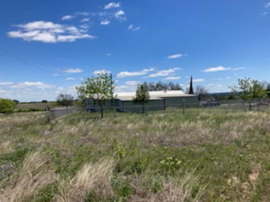 WOW..  over 28 Acres at this New reduced Price.. Hurry.. Ag Exemption - in place...   Perfect for a Home property Perfect for a Weekend Hunting Property OR  Both!  Good Hunting property.. Property is Fenced- Gate at Entrance..Value is mostly in the land -  large Shop in  good shape.. Ask about  Owner Financing