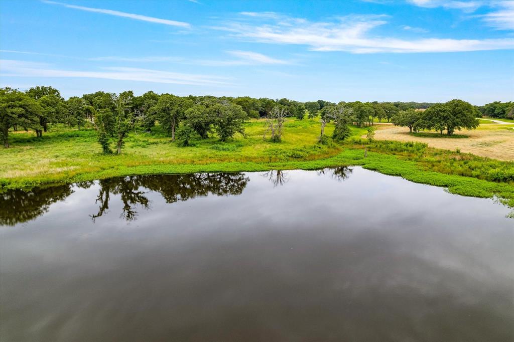 Exceptional 35± acre ranch estate just minutes from Lake Kiowa, offering a rare blend of privacy, beauty, versatility, and long-term investment potential. This remarkable property features a balanced mix of open pastureland and gently rolling terrain, highlighted by breathtaking views overlooking a scenic pond—creating the perfect setting for a luxury custom home, equestrian property, or private ranch retreat.

A gated entrance provides both security and exclusivity, while existing utilities on-site add convenience and value. Whether you're looking to run livestock, enjoy recreational activities, build your dream estate, or hold for future development, this property offers outstanding flexibility to fit a variety of lifestyles and investment goals.

Conveniently located near FM 902 with a favorable tax rate, this is an exceptional opportunity to own a premier North Texas land tract in a highly desirable area. Bring your vision and unlock the endless possibilities this unique property has to offer.

Additional acreage available. The adjoining tract may be purchased, bringing the total available acreage to approximately 71.71 acres.