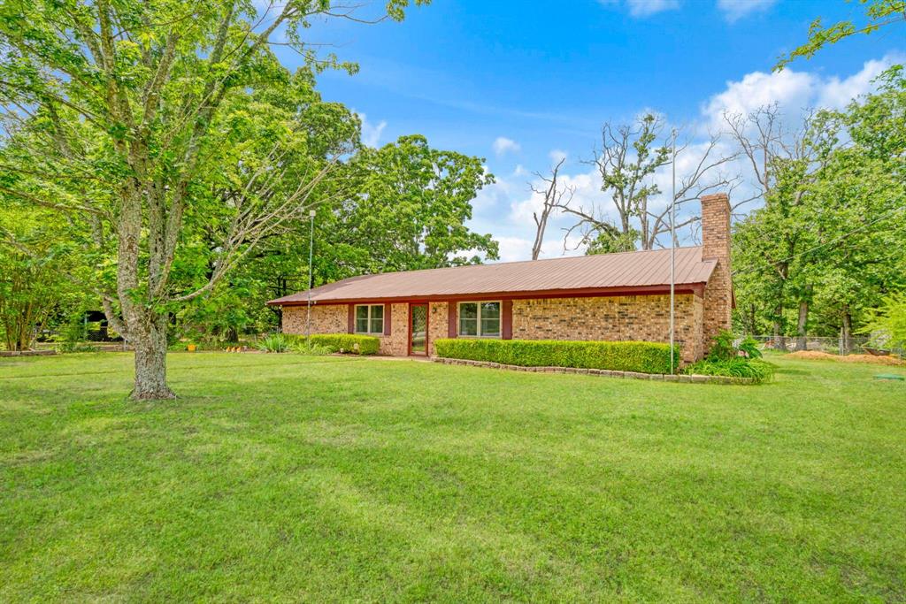 This 3 bedroom, 2 bath offers lots of privacy. This charming home has large rooms throughout. Beautiful custom cabinets with stainless appliances. The outside has lots of features including pond, 12x10 workshop, 40x13 barn and 34x27 RV and boat shed. It also has 32x12 greenhouse and garden plot ready for your planting. Sit back out back in your gazebo and relax in the serene beauty. Also, the front and back yards have in ground sprinkler system. New energy efficient windows installed in 2026. Recent aerobic system. Owner has planted small cherry tree orchard.
