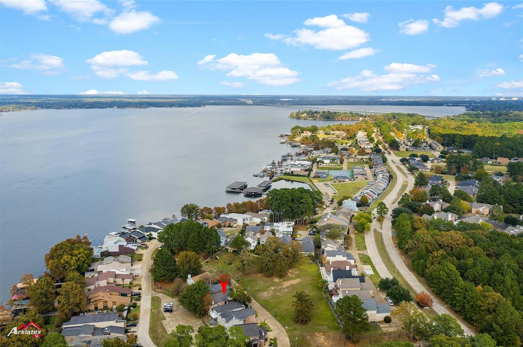 Imagine waking up to lake breezes, stepping out to your balcony with coffee, and calling this your life -- not your vacation.

This is the one people wait for. A fully furnished, move-in ready home inside one of the most coveted gated communities on Cross Lake -- where neighbors know each other by name, amenities rival a resort, and views of the yacht club never get old.

Just over 2,000 square feet, open where it counts. Kitchen, dining, and living flow together effortlessly -- anchored by wood and marble flooring, a wood-burning fireplace, a library nook, and natural light that gives this home a warmth photos can only hint at. The kitchen is fresh and functional with modern appliances and cabinet space that actually makes sense.

The primary suite is a proper retreat -- wood floors, walk-in shower, jacuzzi tub, and real closet space. Two additional bedrooms offer quiet comfort, and a second-floor office makes working from home feel like a perk. Two balconies catch the lake breeze -- one for morning coffee, one for evening wine. The garage has built-in storage and ceiling fans keep you comfortable year-round.

Then there is the community. Private pool. Clubhouse. Tennis courts. Private boat slips. This is a neighborhood where people stay -- where pride of ownership shows up in every detail and residents genuinely love where they live.

Fully furnished and move-in ready, just 10 minutes from downtown Shreveport. Opportunities like this on Cross Lake do not sit still -- come see it for yourself.

Seller intends to sell home furnished. They will be taking little to no furniture and intends to leave all appliances in the home.