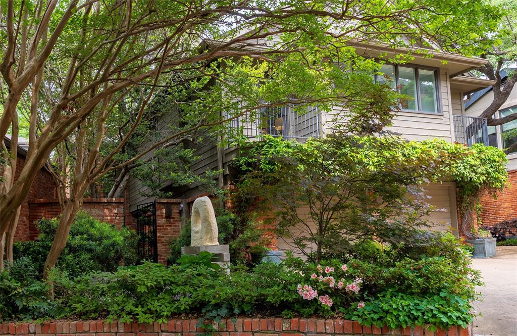 In a private enclave along Turtle Creek immediately adjacent to Highland Park, is Turtle Creek Bend, a cul de sac of 19 single family homes.  A number of these homes enjoy magical views of Turtle Creek including 7 Turtle Creek Bend.  There is much to recommend here.  Besides verdant views of Turtle Creek and being one of Dallas’ most walkable neighborhoods, it has been elegantly updated.  Award winning architect, Russell Buchanan, was tapped to rethink the original design.  Updates include two, up-to-the-minute baths, the primary bedroom suite bath being completed this year.  In the open concept kitchen, stainless steel appliances have been installed, including a built-in Miele refrigerator-freezer.  Floor-to-ceiling windows, with electronically operated window shades, frame the home’s outstanding views, and museum-finish walls and recessed lighting enhance gallery-like living spaces for an art filled home.  The property is entered via a lushly planted, courtyard.  The two-story volume living room, with floor-to-ceiling windows, has breathtaking views of the creek.  On the second floor, the primary bedroom suite, has more wonderful views.  The suite features a second room with floor length windows giving the space a treehouse feeling!  The current owner uses the room as their art studio.  The primary suite bath was taken down to the studs and includes double vanities, a Japanese style steeping tub, a separate, glass enclosed shower and marble and walnut finishes.  An unexpected bonus is the huge family room.  This multi-purpose room has a fireplace and can be used as a third bedroom.  Two additional walk-in storage closets on the second floor as well as a large utility room, make the property an A+ candidate for someone moving from a larger home.  If you have been looking for a stylish, move-in condition, single family home in the Turtle Creek corridor, you must see 7 Turtle Creek Bend.