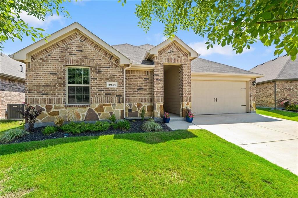 Welcome to 2914 Baldwin Lane in Ennis, TX!  This beautifully well maintained 3-bedroom, 2-bath home offers a functional open-concept layout filled with natural light and welcoming spaces.  The modern kitchen features generous counter space, stainless-steel appliances, plenty of cabinet storage, and a large center island flowing into the living and dining areas.  The spacious primary bedroom provides a private retreat with an ensuite bath, large vanity, oversized walk-in shower and walk-in closet.  While the additional bedrooms offer flexibility for family, guests, or a home office. The home has ceiling fans throughout which provides year-round comfort.  Enjoy the professionally landscaped yard with sprinkler system, fully fenced back yard, cover patio and extended outdoor space--perfect for relaxing or entertaining.  Conveniently located near schools, shopping, dining, major highways, and with Lake Bardwell and a variety of recreational destinations just minutes away.  This move-in ready home offers the perfect blend of comfort, style, and convenience.  Don't miss your chance to make this beautiful Ennis home your own.