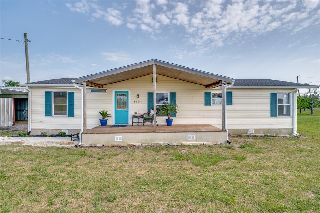 Updated manufactured residence on a generous .53+- acre corner lot in town in Southmayd, Texas. SO MUCH TO OFFER! This 3-2 happy place sports a very large covered rear deck under which to enjoy those special Texas summer nights. There is a new flagstone landing by the deck for your new grill. The property has a double carport AND a heavy duty metal workshop with electricity for storage and projects. The primary bath has been totally remodeled to include a convenient walk-in shower and charming vanity. A large eat-in kitchen welcomes family dinner or game night. A slide-in electric range surrounded by a cute island with a butcher block countertop is great jewelry for the kitchen. A 2022 roof, 2023 HVAC and a 2023 aerobic system make this charmer a great investment!! No HOA. S&S ISD. Excellent small town feel.