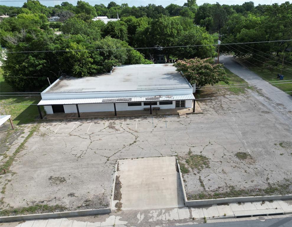Located at 125 E Navarro Avenue, De Leon, TX, this impressive 7,000+ square foot building offers exceptional potential for a variety of commercial or investment opportunities. Conveniently situated just off Highway 6, the property benefits from excellent accessibility and visibility in a well-traveled area.

With its generous square footage and versatile layout, this building offers ample space to bring your vision to life. Whether you're looking to expand, invest, or redevelop, the possibilities are abundant.

Owner Financing Available