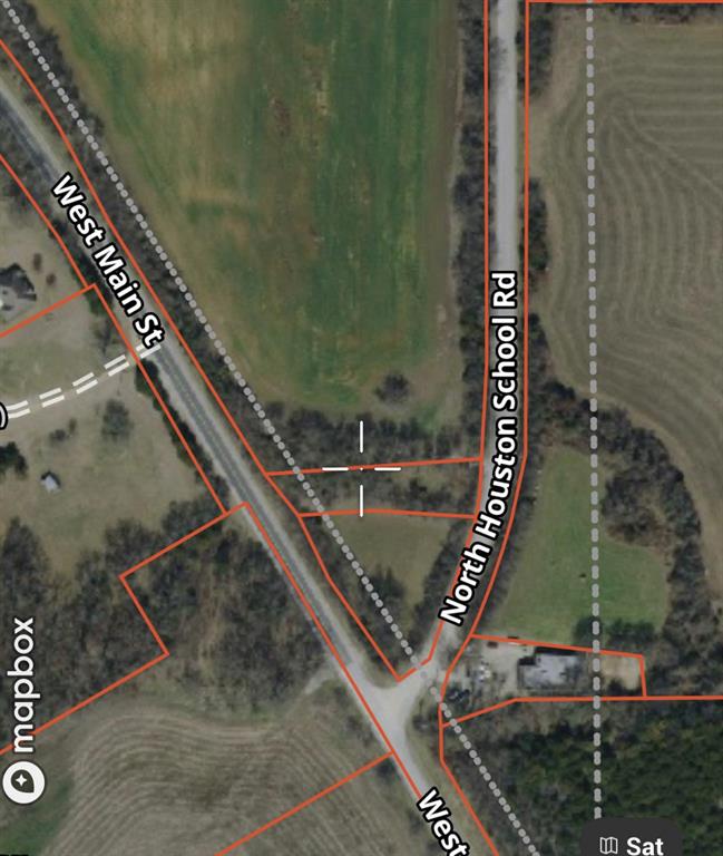 This versatile .47-acre lot offers excellent visibility and accessibility, situated at the corner of N Main Street and Houston School Road with direct frontage on both. Ideal for a variety of uses, the property is currently undergoing the installation of a perimeter wire fence for added security and definition. Gate access is conveniently located on Houston School Road, providing easy entry and exit.