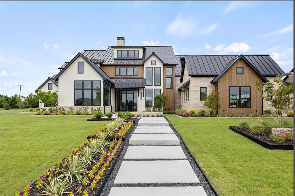 Reduced $107K! This custom design with 4700SF of stunning luxury offers a magnificent layout & interior finish that will be hard to walk away from. The list of included features and finish out in this home will capture your ATTN!! Built by Clay Welch (Welch Family of Builders) on a .6Ac+, this one has it all! This home features the Primary Retreat downstairs along with a secondary ensuite down as wel, oversized private office, separate GmRm (down) that opens to the oversized outdoor living area with fireplace, outdoor grilling area & outdoor dining area. Upstairs you'll find two large secondary ensuites plus a spacious Play rm 3rd Liv. This property is loaded: STANDING SEAM METAL ROOF, CUT-STONE FULL EXTERIOR, EXTENSIVE LUXURTY LIGHTING, EXTENSIVE UPGRADED LUXURY CUSTOM LANDSCAPING, FOUR CAR GARAGE WITH COMMERCIAL GRADE EPOXY FLOORING, 5 inch Level 1 White Oak Wood Flooring thru-out. FULL FOAM ENCAPULATION, DE-HUMIDIFYERS, QUARTZITE COUNTERTOPS, TOP OF THE LINE JENN AIRE PROF' APPL PACKAGE INCLUDING 60 FRIDGE & FREEZER WITH CABINET FRONT.  In the prep Kitchen there are additonal DOUBLE OVERS (4 total)& a 2ND SINK & DISHWASHER...shall I go on?  Ok...Chemical Injection Foundation Prep, Piered Beam Foundation, EXTENSIVE UPGRADED Anderson Window Package with 16ft Slider in Family Room, 60in Linear Fireplace plus 2nd fireplace in Primary. Tons of indirect lighting..Outdoor Grilling Area...oh, did I mention it's located in Ridge Lakes, Heaths most desirable Luxury Community! Come on!