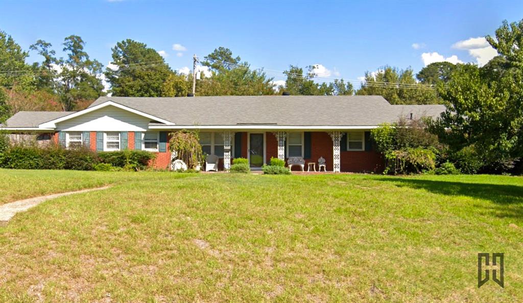 Huge Price Enhancement!! Welcome to this custom beauty in the heart of Minden, Louisiana! Offering 3 bedrooms and 3 bathrooms, this spacious home is designed with comfort and convenience in mind. With two master suites, two living areas, and two dining areas, there’s plenty of room to spread out, entertain, and accommodate everyone. The updated kitchen is a standout, featuring Corian countertops, a stylish tile backsplash, double ovens, and custom cabinetry. Just off the kitchen, the cozy den with a fireplace creates a warm and inviting space to relax after a long day. Both master suites are generously sized with walk-in closets, offering comfort and privacy. The flexible floor plan ensures everyone has space to gather or retreat as needed. Outside, you’ll love the large fenced backyard on a desirable corner lot, complete with a nice-sized back patio—perfect for grilling, entertaining, or simply enjoying the outdoors. The 16x24 heated and cooled workshop is another highlight, ideal for hobbies, projects, or even a home office, thanks to its mini-split climate control system. Conveniently located just off Homer Road, this property offers easy access to restaurants, grocery stores, and shopping, making everyday living a breeze.