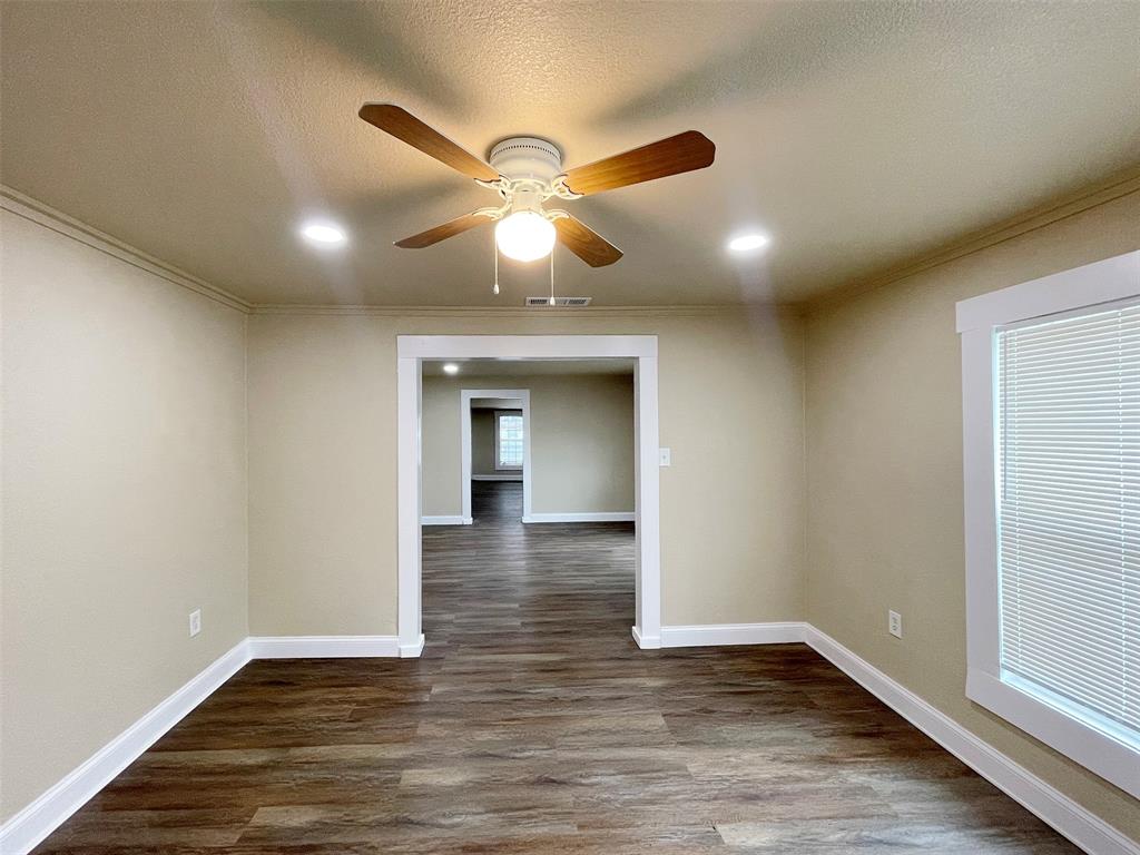 Incredible investment opportunity in the heart of Historic McKinney! Situated on a large lot  big enough to build two houses just a few blocks from vibrant Downtown McKinney, this property offers endless potential. Build the home of your dreams or move right into this charming starter home and enjoy it as is.

The home has been recently remodeled with fresh interior paint and new laminate flooring throughout. Major updates include a new roof (2025) and water heater (2024), providing added peace of mind.

Inside, you'll find three bedrooms plus a versatile bonus room that can serve as a home office. The kitchen features a new stove and dishwasher, making it move-in ready.

A detached two-car garage offers secure parking, while the additional driveway provides extra convenience. Plus it has a separate room in the back of it that can be used a shop or extra storage.The spacious backyard is shaded by mature trees, creating a private setting with plenty of room for entertaining, gardening, or future expansion.
