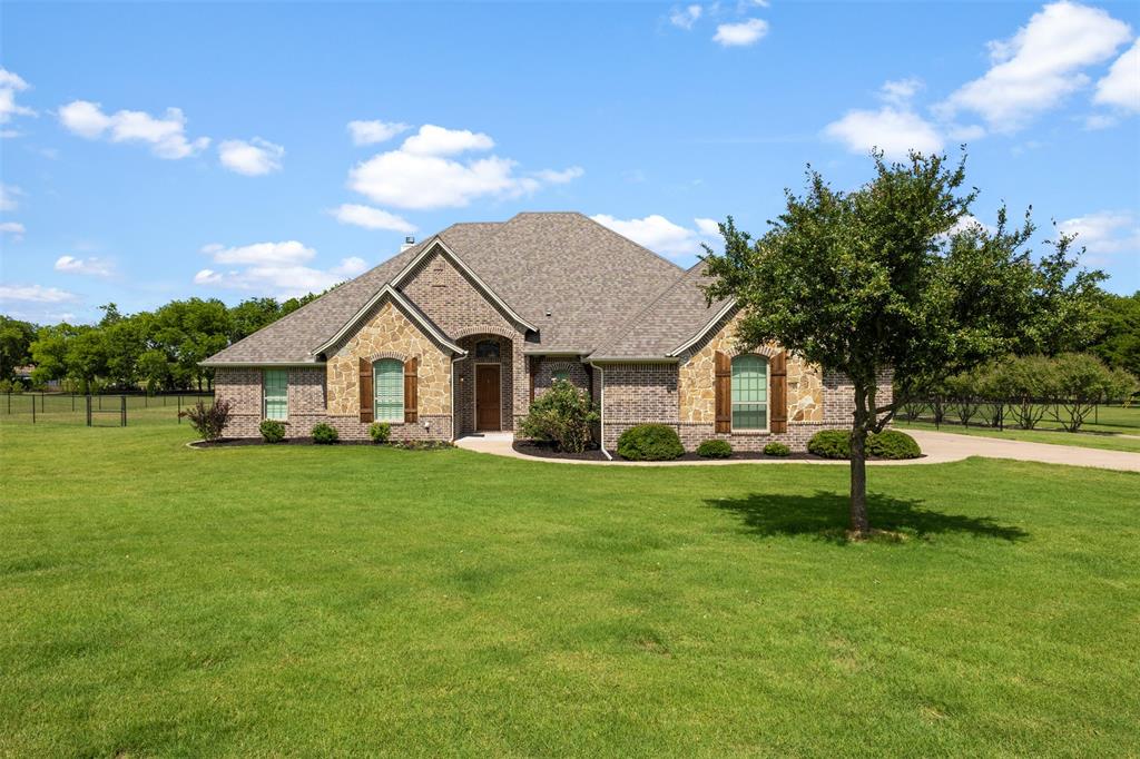 This beautifully maintained 3 bedroom, 2.5 bath home located in a highly desirable area. As you enter, you'll be welcomed by a dedicated study featuring custom built-in bookshelves, creating the perfect space for a home office, reading room, or flex space. The impressive 20x20 living room serves as the heart of the home and features a stunning stone wood-burning fireplace, crown molding, recessed lighting, and brand-new carpet throughout. The oversized kitchen is designed for both everyday living and entertaining, offering granite countertops, abundant cabinet space, a walk in pantry, breakfast bar, and spacious dining area. Whether you're hosting family gatherings or enjoying a quiet evening at home, this kitchen delivers both style and functionality. The private primary suite provides a relaxing retreat with a luxurious ensuite bath featuring a garden tub, walk-in shower, dual vanities, and a large walk-in closet. Additional bedrooms are generously sized and positioned separately from the primary suite for added privacy. Outside, you'll appreciate the beautifully landscaped yard, fenced backyard, and 3 car garage. Major updates include a new roof installed in 2025 and the added peace of mind of a Generac whole-home generator. Best of all, enjoy the benefits of NO HOA and NO CITY TAXES, giving you more freedom and lower ownership costs while still being conveniently located near shopping, dining, schools, and major commuting routes.
