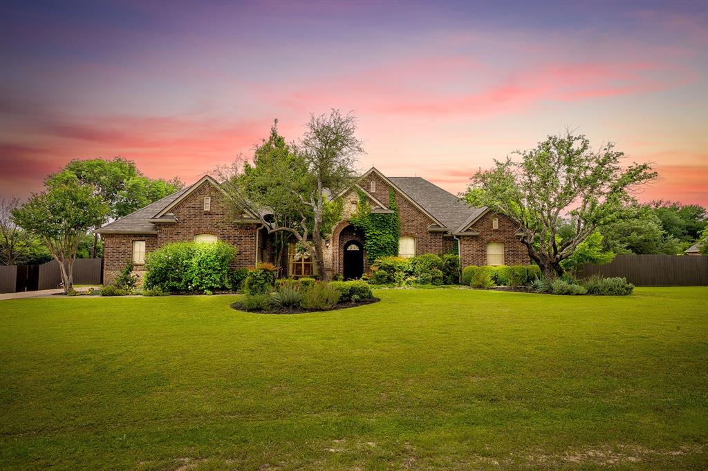 Welcome to this exceptional custom estate nestled on a quiet cul-de-sac and situated on a beautifully wooded one-acre lot designed for both everyday comfort and unforgettable entertaining. This thoughtfully designed custom Sean Knight 4-bedroom, 3.5-bath home offers the perfect balance of luxury, privacy, and functionality with a 3-car garage and timeless architectural details throughout.
From the moment you arrive, the impressive custom solid wood front door sets the tone for the craftsmanship and elegance found inside. Rich hardwood flooring flows seamlessly throughout the main living areas and into the spacious primary suite, creating warmth and sophistication at every turn.
The floor plan was designed with entertaining and relaxation in mind, featuring expansive living spaces and abundant natural light. The gourmet kitchen opens beautifully to the main living and dining areas, making gatherings both intimate and inviting.
Step outside to your own private outdoor oasis featuring a large sport court equipped for both basketball and pickleball — perfect for recreation, hosting friends, or active family living. The sprawling backyard offers exceptional privacy, shade, and a peaceful natural setting rarely found. Plenty of room to add a pool in the future.
Additional highlights include a private well, 3,000-gallon water cistern, whole home water filtration, and reverse osmosis water filtration in kitchen. This is more than a home — it’s a private retreat built for connection, recreation, and refined living.