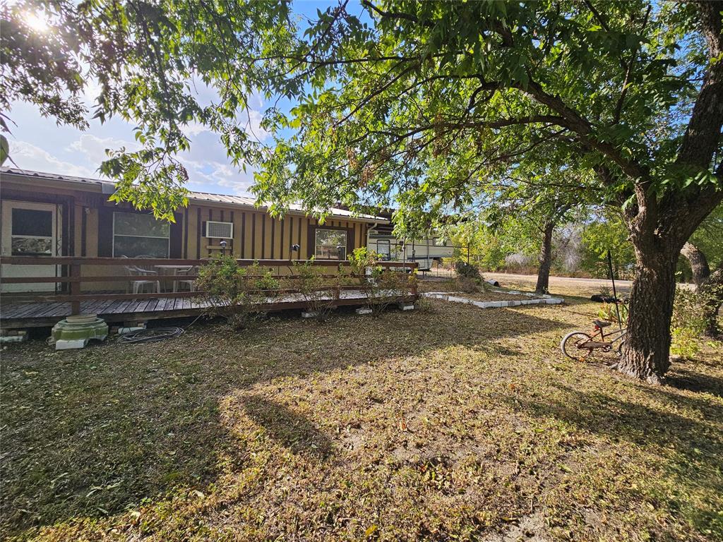 Pier and Beam Home in the center of Morgan, TX. Not many of these opportunities come up that include approximately 1.24 Acres in a small town. 2 properties for the price of one. Completely fenced with cross fencing w multiple entry gates. 2 sep electric meters, 2 sep water meters, 2 sep gas lines. The back of the property used to have a mobile home, so utilities already in place would make a great lot to add a second home to generate income, inlaws, a massive workshop,  guest house, or subdivide.  Beautiful huge Pecan Trees, Metal Roof, Solid Hardwood Floors, spacious, and lots of storage. An area just off the back of the kitchen is where the family enjoyed canning. Room addition with a huge hot tub not finished out could be for an additional room. Massive areas for gardening, animals, a greenhouse, and a chicken coop. Several large storage buildings used as workshops and equipment storage. Boat and Camper Covered Parking. Bring your animals. It's country living in a small town!