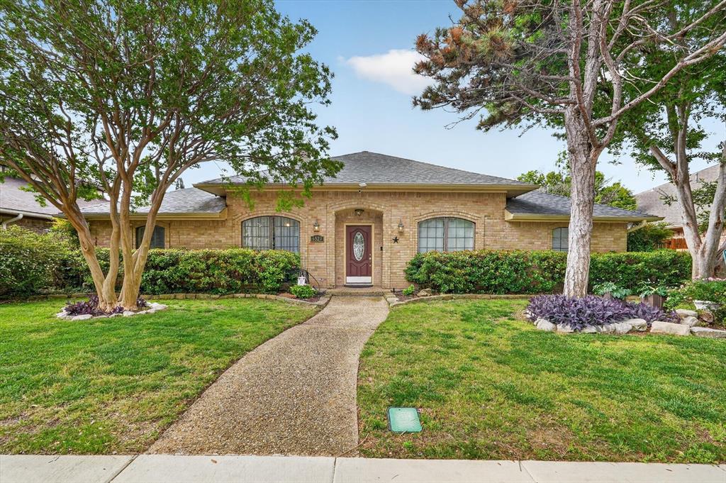 Located in sought after Prestonwood, this beautifully designed single story home offers 4 bedrooms, 3 full baths, a dedicated office, and multiple flexible living spaces that truly adapt to your lifestyle. From the moment you walk in, you are greeted with abundant natural light, vaulted ceilings, and a spacious living room anchored by a wet bar, creating the perfect setting for entertaining or relaxing evenings at home. The thoughtful floor plan includes a private mother in law suite with a full bath just off the fourth bedroom, which also works perfectly as a media room, game room, or flex space depending on your needs. The kitchen flows easily to a secondary side patio, ideal for grilling and outdoor dining. The sun room is filled with natural light and overlooks the pool, offering a peaceful space to unwind while staying connected to the backyard. The primary suite is tucked away for privacy and features generous space and a well appointed bath layout. Step outside to your own backyard retreat complete with a sparkling pool, perfect for Texas summers, plus additional patio space for lounging and entertaining. With its versatile layout, natural light throughout, and seamless indoor outdoor flow, this home checks all the boxes for comfort, functionality, and everyday enjoyment, all with easy access to the Dallas North Tollway, US 75, and nearby shopping, dining, and entertainment.