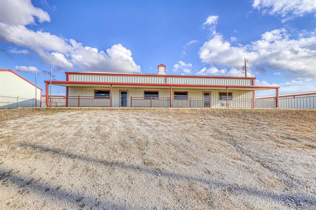 Position your business for success with this highly versatile 3,200-square-foot commercial property conveniently located just 500 feet off SH-199 between Azle and Springtown. Offering exceptional visibility, accessibility, and flexibility, this property is well-suited for a variety of business uses including retail, office, service-based operations, distribution, light industrial, or a combination of all three. Approximately 1,800 square feet of heated and cooled space provides an ideal setup for offices, cubicles, customer-facing retail, call center operations, or collaborative workspaces. An additional 800+ square feet of insulated warehouse space offers ample room for inventory, equipment, storage, or light manufacturing needs. Completing the package is an 800-square-foot covered porch, creating valuable space for outdoor operations, customer pickup, equipment storage, or future expansion opportunities. The possibilities are endless; bring your vision and make this adaptable commercial space work for you.