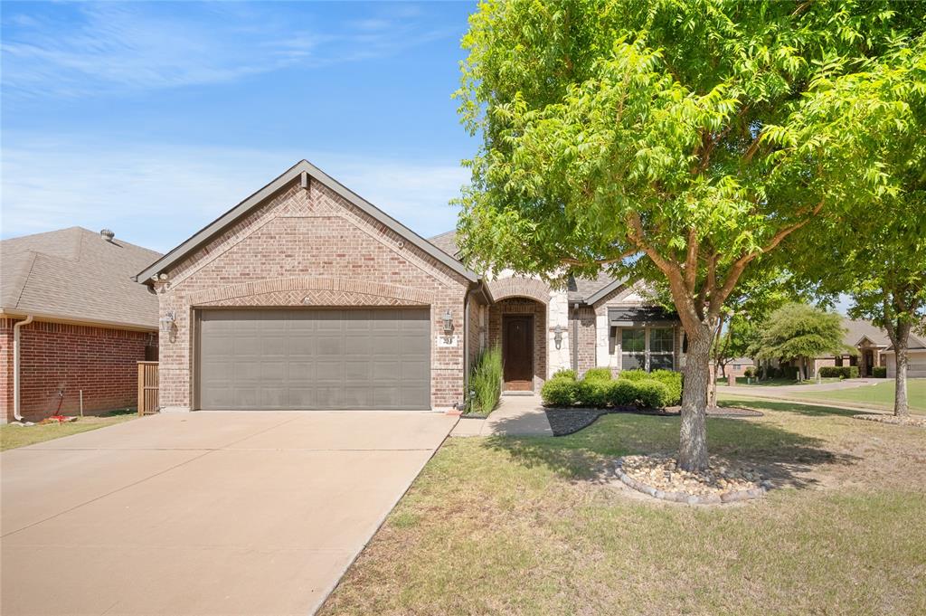 Open house Sat 7-11 from 11-1! Welcome to this beautifully maintained one-owner home in the heart of Waxahachie, TX, offering the perfect blend of comfort, style & convenience. Ideally located with quick access to Hwy 287 & I-35, this 3-bedroom, 2-bath home sits on a corner lot in a sought-after community. The open-concept layout is filled with abundant natural light, soaring 10 ft ceilings & features a split-bedroom design with each bedroom separated for added privacy. The living room showcases hardwood floors, crown molding, 5.5-inch baseboards & is wired for surround sound. The kitchen offers granite countertops, tile backsplash, a walk-in pantry & ample prep space while seamlessly flowing into the dining & living areas, creating an open, inviting floor plan that's perfect for entertaining family & friends. The oversized primary suite features windows overlooking the beautifully landscaped backyard, a massive walk-in closet & plenty of room to unwind. There is no carpet anywhere in the home, making maintenance a breeze. Beautiful arched walkways add architectural charm, while a built-in security system with cameras offers peace of mind. Storage is plentiful with a fully decked attic, backyard storage shed, ceiling storage in the garage & a large utility room with space for a refrigerator or freezer. The backyard is truly an escape with a covered pergola, lush landscaping, colorful flowers & mature plants lining the fence. Enjoy the unique 350-gallon above-ground stock tank plunge pool with filtration, perfect for relaxing with room for 2-3 people. The roof was replaced in 2023, reflecting the exceptional care this home has received. Neighborhood amenities include a recently added basketball court, pickleball court, playground & batting cages. If you're searching for a move-in ready home in Waxahachie with modern finishes, beautiful outdoor living, easy highway access & thoughtful upgrades throughout, this meticulously cared-for home is one you won't want to miss.