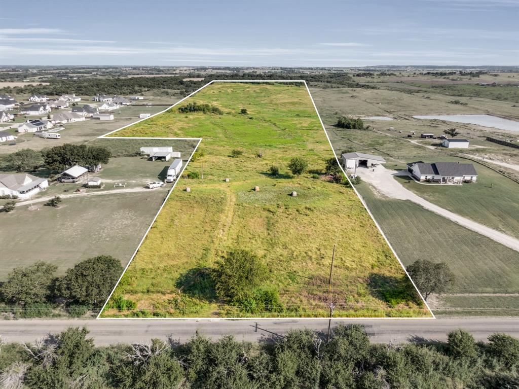 Located just minutes from downtown Maypearl with a Waxahachie address, this 25± acre property in Maypearl ISD offers a rare blend of rural charm and development potential. No known deed restrictions, water provider is Buena Vista-Bethel SUD and electricity via Hilco Electric Co-op, the possibilities are wide open. Whether you're envisioning a private homestead, working ranchette, or grazing land for horses, cattle, or other livestock, this land checks all the boxes. Developers and investors will also appreciate the potential for a residential subdivision, RV park, storage facility, especially in this fast-growing area of Ellis County. Just 0.5 mile off FM 157 and easily accessible to both Maypearl, Waxahachie, and Midlothian, this property combines convenience with open space and flexibility, ideal for those looking to build, invest, or expand.