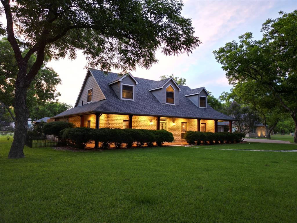 Don't miss this rare opportunity to own a one-of-a-kind Texas Airpark farmhouse in the highly sought-after Pecan Plantation Airpark. Nestled on a beautiful 1.85-acre cul-de-sac lot with more than 32 mature pecan trees, this property offers concrete taxiway access on two sides leading directly to the 3,600-foot hard-surface runway (FAA Identifier 0TX1). The extensively remodeled residence offers approximately 2,753 square feet of climate-controlled living space, including a 2,403 SF main home with 3 bedrooms and 2.5 baths, plus a separate 350 SF casita featuring a bedroom, full bath, and private garage. Major updates include a redesigned open floorplan with structural beams, Belle Cera French Oak flooring, custom shaker cabinetry, marble countertops, premium appliances, beautifully renovated bathrooms, smart home features, a new roof, tankless water heater, upgraded insulation, and new HVAC systems. The 2,000 SF airplane hangar includes an office, bathroom, new Schweiss bi-fold door, and Big Ass Fan. Outdoor amenities include a screened patio, H2X fitness swim spa, irrigated garden, and beautifully maintained grounds. Enjoy all the amenities of Pecan Plantation, including golf, tennis, marina access to Lake Granbury, shopping, dining, parks, and one of Texas' premier residential airparks.