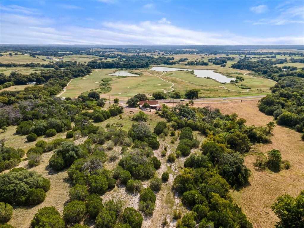 TRULY ONE OF A KIND HISTORIC HOME with 20 ACRES WITH STUNNING VIEWS.   Step back in time with this amazing PETRIFIED rock home built in 1929.   Perched atop a hill with breathtaking and panoramic views of Squaw Valley Golf Course below.  Rich in history and character.  Featuring a large enclosed screened porch makes it perfect for relaxing and enjoying the peaceful surroundings and unmatched privacy.  The petrified rock fireplace in the living room is gorgeous and filled with so much detail. There is approximately 8 acre field below the home that borders Squaw Creek and more property available for additional exploring or expansion.  WAS ORIGINALLY LISTED AS 49+ ACRES. NOW WITH HOUSE AN 20 ACRES.

There is an additional 29+ acres available that can be purchased.