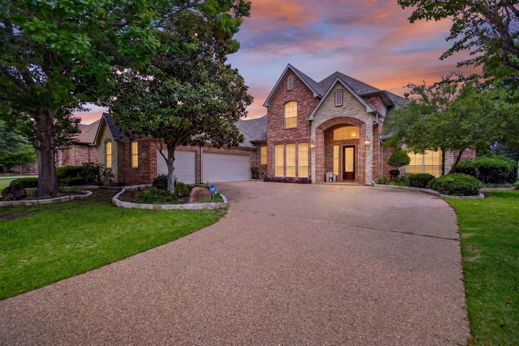 Nestled within the prestigious Southern Oaks Golf & Tennis Club and perfectly positioned along the 14th fairway, this exceptional home offers breathtaking golf course views and unforgettable sunsets. Expansive floor-to-ceiling windows in the great room fill the home with natural light while showcasing the picturesque setting beyond. Designed with both elegance and functionality in mind, the thoughtfully crafted floor plan features two upstairs bedrooms connected by a Jack-and-Jill bath, along with a spacious loft complete with built-in desks and cabinetry—ideal for students, a home office, or a flexible living space. Upon entering, guests are welcomed by formal living and dining areas accented by plantation shutters and a stunning wood staircase with wrought-iron railing. At the heart of the home, the beautifully appointed kitchen serves as the central gathering place, featuring granite countertops, rich wood cabinetry, a center island, breakfast bar, and an oversized walk-in pantry.
The downstairs layout offers privacy and convenience with two additional bedrooms and two full baths situated on opposite sides of the home. The spacious primary suite is a true retreat, boasting dual vanities, a relaxing garden tub, separate shower, and a large walk-in closet.
Throughout the home, quality craftsmanship is evident in the extensive built-ins and attention to detail. Combining timeless elegance, abundant natural light, and a premier golf course location, this Southern Oaks residence is truly a place to call home.