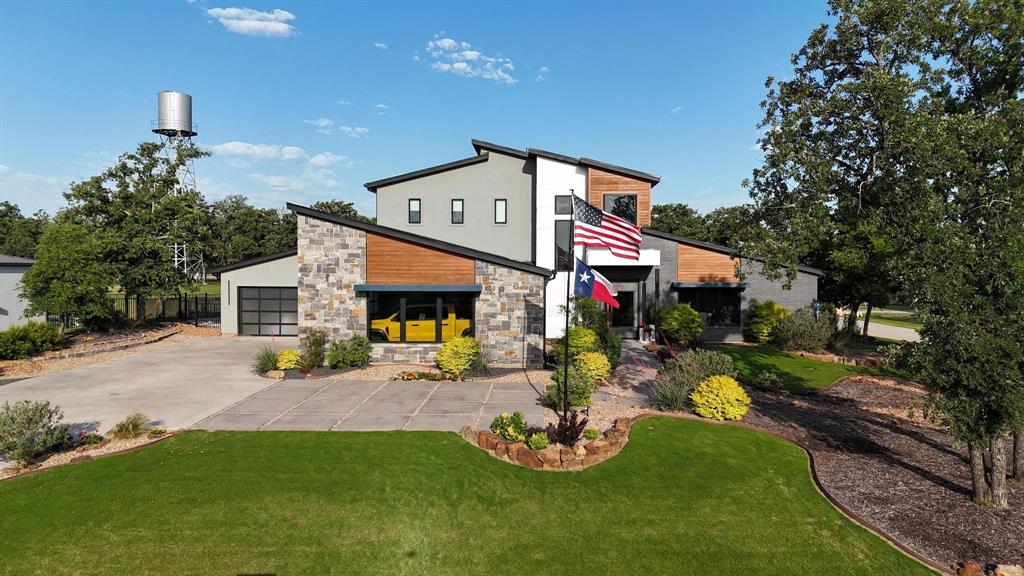 Where Legacy Lives. Modern luxury meets function in this Pacific Northwest-inspired estate on a heavily treed corner lot in gated Copper Canyon. With 4,664 sq ft, the main house features a floating staircase, two dedicated primary suites, double island chef’s kitchen, commercial appliances, huge pantry, and entertainer’s lounge. The additional 601 sq ft guest house includes a full studio complete with top-tier golf simulator,  kitchenette and full bath. Enjoy outdoor living with your saltwater pool and spa, firepit, multiple covered patios, and custom putting green.  The oversized 5 car garage, and Smart Home tech blends style, privacy and multi-gen versatility.  (Total finished square footage equals 5,265)