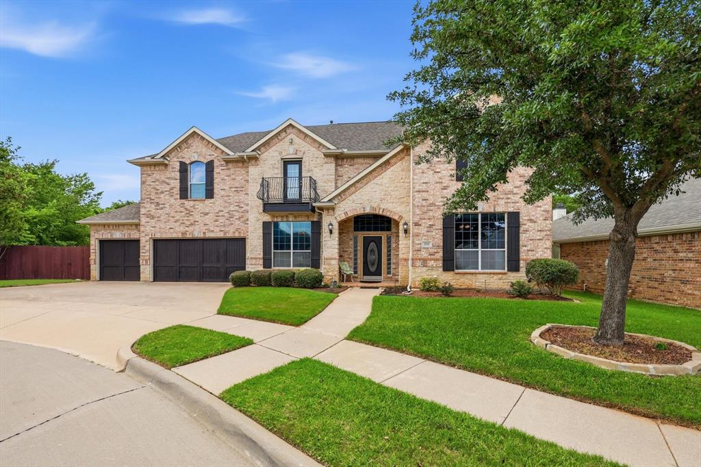 Spanning more than 3,600 square feet, this exceptional home offers an ideal blend of space, functionality, and scenic beauty nestled within a coveted gated community overlooking The McCormick Park Pond. With 4 oversized bedrooms, 3 full baths, and a half bath, there is plenty of room for both everyday living and effortless entertaining.

The first floor features a private executive office complete with an ensuite bath and large walk-in closet, making it also an ideal fifth bedroom or guest suite. The expansive living room opens seamlessly to the well-appointed kitchen and frames picturesque views of the backyard and surrounding nature preserve. Rich, true hardwood flooring throughout the living room, dining room, and executive office adds warmth and elegance while setting this home apart from others.

Designed for the home chef, the kitchen offers abundant counter space, extensive cabinetry, a large pantry, and a charming breakfast nook with built-in storage. A full-size laundry room with utility sink and generous storage throughout the home add everyday convenience.

The spacious primary suite opens to a private balcony overlooking the preserve, creating the ultimate peaceful retreat. All secondary bedrooms are generously sized, and one enjoys direct access to a shared bathroom. Brand new carpet on the stairs and upstairs areas completes this level with a fresh feel.

Additional highlights include a three-car garage with a half bath for garage work or gardening convenience.

Residents enjoy resort-style amenities including a clubhouse, community pool, scenic greenbelts, jogging trails, a fishing pier, and access to two parks—all set against the natural beauty of McCormick Pond Preserve.

Located in a top-rated school district and just minutes from an extensive amount of premier shopping, dining, entertainment, DFW Airport, and the new H-E-B Grocery Store, this home offers luxury living in one of the area's most desirable communities. Welcome home!