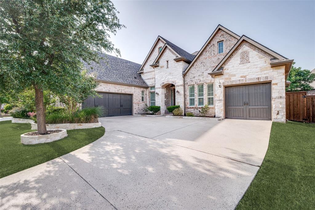 RARE SINGLE-STORY HOME IN DESIRABLE WEST FRISCO! Elevated design elements set this home apart. Upon entry, framed archways with intricate wood trim detailing create an elegant first impression. Premium 8-inch white oak wood flooring flows throughout all main spaces. A private study with french-doors and wood shutters sits opposite the open dining space showcasing a striking crystal chandelier. The living area is anchored by a floor-to-ceiling stone fireplace wall with natural wood mantel, a contemporary chandelier and features in-wall surround speakers. Custom silhouette blinds dress a wall of windows overlooking the backyard and continue to the breakfast nook, creating a light-filled setting for everyday meals. The kitchen is a show stopper with matching stone backsplash that beautifully contrast the rich knotty alder cabinets while complimenting the porcelain farmhouse sink. The upgraded pot-filler and matching sink faucet are statement pieces. Stainless appliances including a 5-burner gas cooktop and double wall ovens. Two designer pendants hang above the luxurious granite island with beveled edge. Tucked behind the kitchen are three secondary bedrooms with walk in closets, two full baths and a utility room with sink. The well-designed floorplan offers ideal functionality, with the private primary suite on the opposite wing. Its ensuite bath features dual vanities with granite counters, an oversized shower, and walk-in closet spanning nearly the length of the bathroom. The classic front elevation boasts a timeless blend of brick and stone, complemented by an extra wide driveway and split three-car garage with epoxy flooring. Additional updates include full roof and gutter replacement (2024) and living room recessed lighting. Adjacent to the Dallas North Tollway and zoned for top rated Frisco ISD schools, Emerson Estates is a boutique community in a prime Frisco location with the new Fields West development going in nearby.