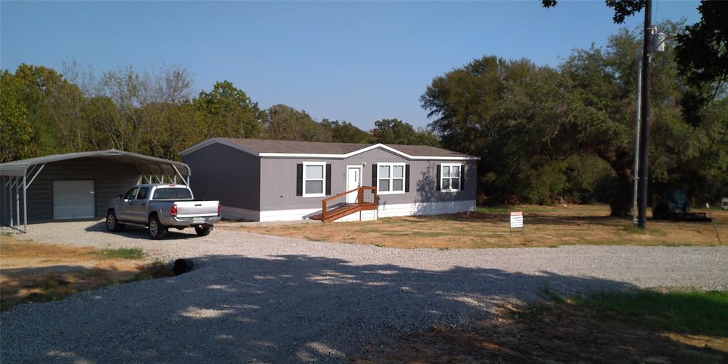 Owner Finance Available !  20% down, 15 year loan,  8-10% interest.  Brand New Doublewide mobile home on 1.25 acres.  At the end of a new private subdivision.  Very quite and private location.  Lots of trees and a creek running behind the house.  New carport with 10x20 storage building being installed.  New patio and decks being installed. Metal skirt.  Nice large shade tree to the side of the house that gives great shade.