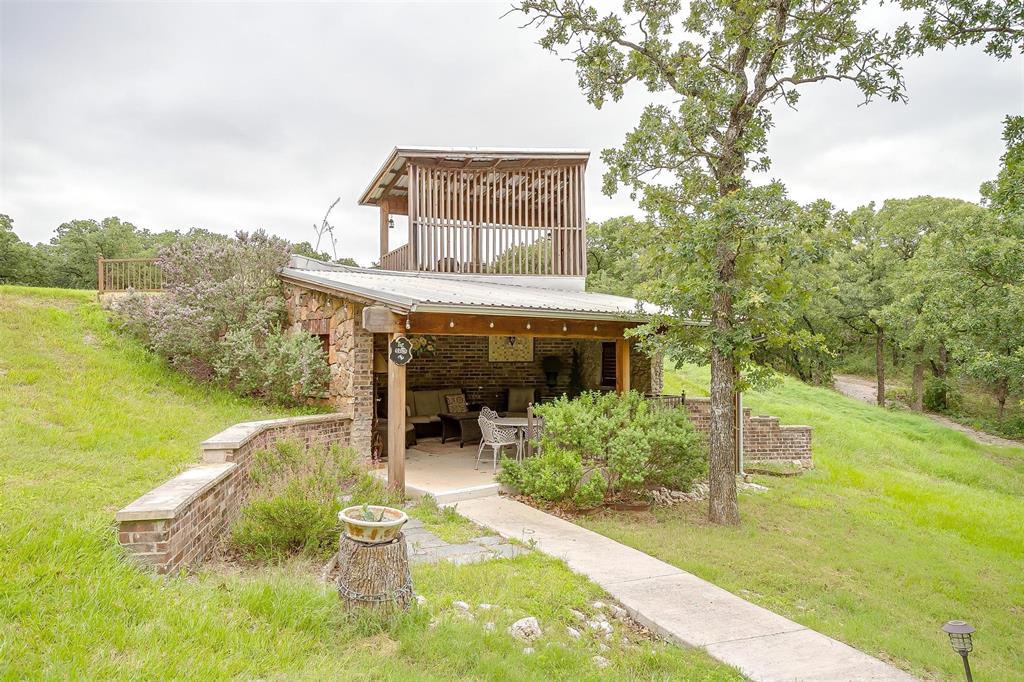 LOCATION, LOCATION, LOCATION—this property offers a rare blend of privacy and accessibility, unique peacefulness with nature, delivering a true rural retreat feel while located ONLY 36 MILES TO DOWNTOWN FORT WORTH, TX. Enjoy easy access to downtown dining, culture, and entertainment, including the historic Stockyards, Sundance Square.

The property spans 39.26 gated, fenced, unrestricted acres with no zoning or use restrictions, allowing exceptional flexibility for future development or long-term ownership. Originally acquired in 2009, with improvements added in 2011, 2012, 2014, and 2015, the estate features mature infrastructure and multiple permanent structures. The offering is real estate only; no operating business is conveyed. Improvements include four full residences, four studio-style guest units, a pool house, laundry facility, and a dedicated event center with two fireplaces, an on-site bar, and a separate full kitchen with convenient service entrances.

The open acreage and existing infrastructure support a wide range of potential uses, including a private or multi-generational estate, retreat or wellness campus, venue or resort-style development, RV or tiny home community, 55+ community, storage or flex-space concepts, or short- and long-term rental strategies. Individual buildings may also be leased independently for health, beauty, wellness, or professional operators, subject to buyer’s intended use.

Outdoor amenities are thoughtfully placed throughout the grounds and include swings in mature trees, covered porches, pergolas and gazebos, firepits, a scenic bridge, walking trails with prayer and meditation areas, and multiple gathering spaces. Recreational features include a life-size outdoor chess set, putting green, half-court basketball area, open field for sports, two outdoor showers, and a stocked pond for catch-and-release fishing. Buyer and buyer’s representative are responsible for verifying all information and intended use.