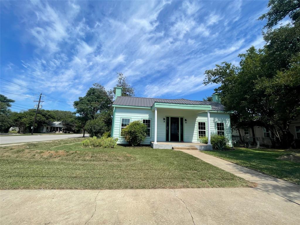 This exceptional property, situated on a high-exposure corner lot, offers a rare combination of residential tranquility and commercial potential. Whether you envision it as a professional office space or a luxurious residence, this completely remodeled property is a true showstopper. Featuring three bedrooms, a central dining area, and an oversized living room with extra-tall, grandiose ceilings and two working fireplaces! Every detail has been meticulously crafted, from the exceptional trim work and molding to the sophisticated paint colors and vinyl flooring. The modern kitchen is a chef's delight, boasting granite counters and stainless-steel appliances. Spray foam insulation and insulated windows act as a super sound reducer, making the interior surprisingly peaceful and quiet, despite the hustle and bustle outside. You’re sure to be impressed, come take a look today!