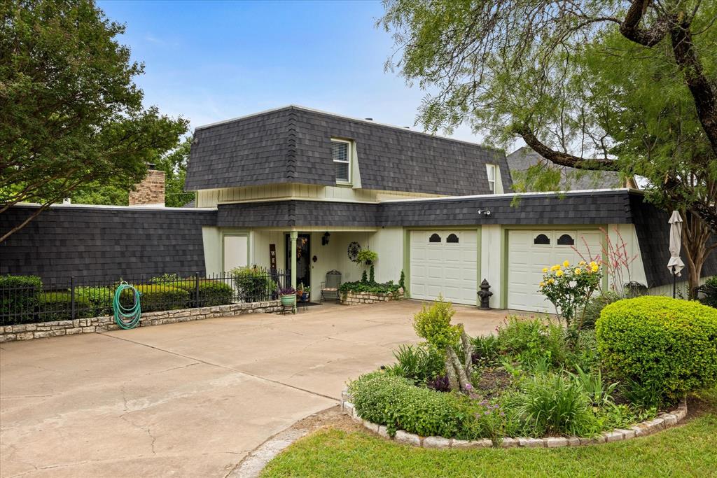 Outstanding, very early model home with 3 bedrooms and 3 full baths (1 full bath for each bedroom)!  Just a fantastic style of home with the primary bedroom and bath downstairs and two bedrooms and two full baths upstairs!  The upstairs also includes a very majestic loft for a great view of surroundings in the home.  The very large eat-in kitchen is just special with a large island and a second sink.  All appliances are built-in with a new double oven and trash compactor.  A half bath also exist on the hall off the kitchen.  A large closet close to the kitchen was originally a Wet Bar, in-which the cabinet was removed by owners.  All plumbing is still there if a new buyer wanted to re-install new cabinets for a bar. The home consist of a large living area and dining area off the kitchen with a large wood burning fireplace and sound system wiring. The primary bedroom has a propane fueled fireplace and a walk-in closet.  The outside of the home has nice patio areas, hot tub with a pergola, a large out-building for workshop or storage, a dog run and very nice landscaping.  The roof is 1 year old with composition shingles and TPO synthetic flat roofing materials. The subdivision consist of boat ramp, club house, community dock, community pool, golf, fitness center, lake access, playground, RV parking, marina, pickle ball, basketball court, tennis, etc.  The garage is unique with 4 closet areas and washer & dryer area.  The subdivision includes two guard gates and perimeter fencing. Home is located one property from Nine Hole Golf Course.