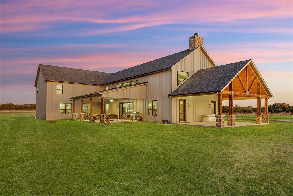 Welcome to your dream retreat!!! A breathtaking luxury barndominium nestled on 10 acres of unspoiled countryside. This one-of-a-kind estate blends high-end design with timeless rural charm, offering over 5800 square feet of thoughtfully curated living space bathed in natural light. Step inside to soaring ceilings, expansive open-concept living areas, and oversized windows that bring the outdoors in, offering panoramic views of the surrounding landscape. Every detail has been meticulously crafted, from the real hardwood floors, gourmet chef’s kitchen, custom cabinetry, walk in pantry, closets, floor to ceiling stone fireplace, oversized garage, loft and media room area. You will also find additional 1300 square feet patio space and 1048 square feet of garage space. Whether you're entertaining in the stunning great room, relaxing on the covered patio, or enjoying the peaceful seclusion of your private acreage, this home provides the perfect balance of modern luxury and laid-back country living. Top 2 private schools near by are Poetry Community Christian School and Providence Academy. Pool is renderings