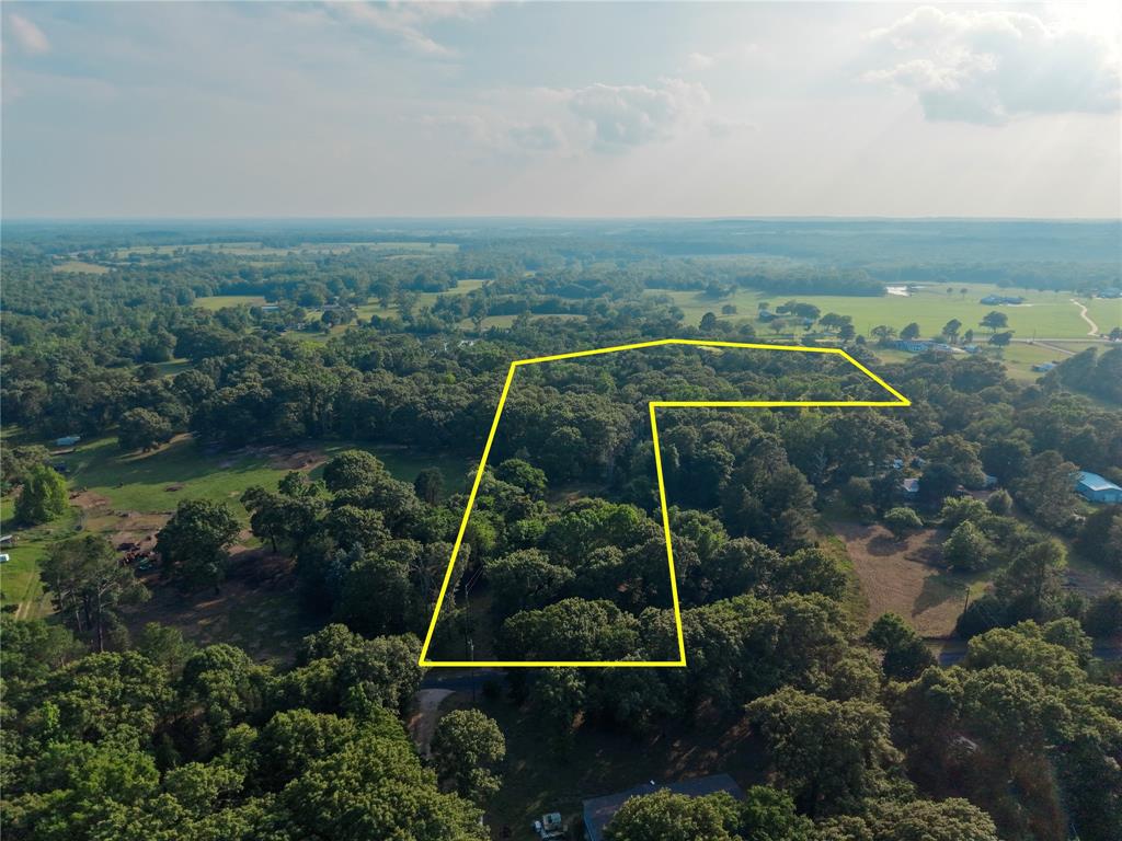 Two parcels totaling 9.4 acres south of Canton with no known restrictions, mature trees, partial open areas, and 200 plus feet of road frontage along VZ County Road 4114. This combined tract offers a more private, natural setting with room for a future homesite, weekend retreat, recreational use, or long-term land hold. A small pond sits toward the back of the property, adding character to the setting, and two existing mobile homes and other structures are present needing hauled off. Electricity and water available, new septic most likely needed. Located in Martins Mill ISD with asphalt county road access and flexible use potential. New survey on file just completed!!
