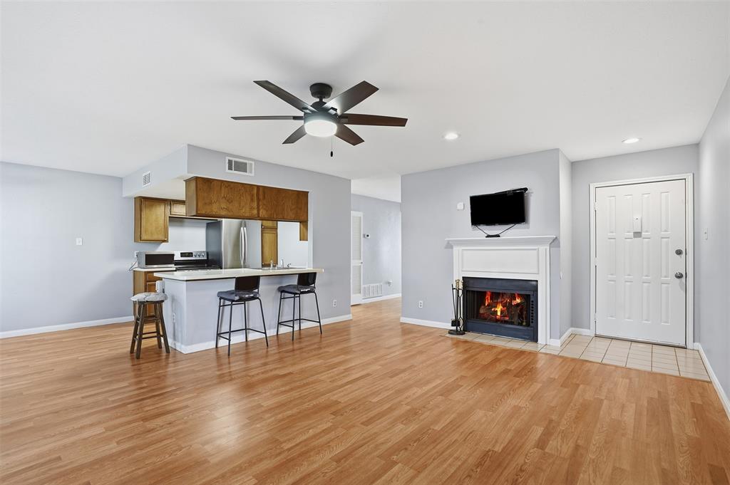 PRICE DROP + SELLERS WILL HELP WITH CLOSING COSTS! DON'T MISS THIS OPPORTUNITY! A first-floor condo in vibrant north Oak Cliff. This one-bedroom, one-bath condo with a bonus room offers a blend of comfort, functionality, and low-maintenance living. The living room features a cozy fireplace and a direct exit to a private patio. The dining space is filled with natural light and offers peaceful views of the open landscape. The bonus room provides incredible flexibility and can be customized to suit any lifestyle — whether you need a home office, hobby room, fitness area, creative studio, or additional storage space. The primary bedroom faces the front of the unit and offers generous closet space, as does the rest of the condo, providing ample storage throughout. The bathroom is thoughtfully designed with dual sinks, plus a separate room for the toilet and shower, adding both comfort and privacy. This condo also includes space for a full-size, side-by-side washer and dryer, a highly desirable convenience for condo living. The kitchen features an open layout that flows seamlessly into both the dining and living areas, making it ideal for entertaining and everyday functionality. Located in a lively and rapidly flourishing area of Dallas, this home offers close proximity to downtown Dallas, Trinity Groves, Bishop Arts District, and major highways- making commuting and city exploration effortless! Residents can easily enjoy nearby dining, entertainment, and neighborhood attractions. Outdoor enthusiasts will love being close to the trails of the Dallas Loop trail system- great for nature walks and enjoying urban wildlife. Community amenities include a refreshing community pool, ideal for relaxing and socializing during warm Texas days. The unit is also conveniently located just a short distance from the community mailboxes and pool. This home delivers comfort, flexibility, and location! Contact your favorite Realtor today and schedule a tour! ALSO FOR LEASE: $1450 A MONTH