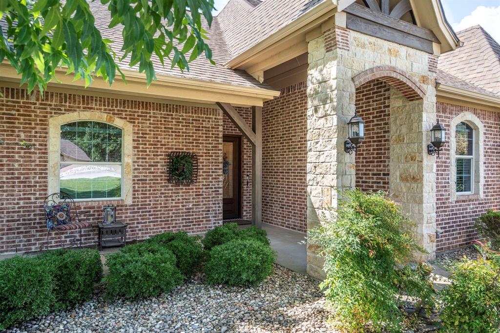 The definition of Open Concept and Outdoor Living! Come see this one of kind property in the gated community of Pecan Plantation, Granbury with 4 bedroom, 3.5 bath, 2 dining, 2 living, plus a dedicated study area. This home could easily be used for multi-generational living, as the primary and guest bedrooms are separate from the secluded TV room flanked by two bedrooms and a bath; a separate wing with the close of a door! The heartbeat of the home features a designer remodeled kitchen with Kitchenaid Cafe appliances, Blue Dunes leathered granite, white oak columns, a Blanco sink and Brizo plumbing accessories. Just steps away, the Outdoor Kitchen will keep the Grill Master busy year round with a Blaze 5-burner grill, Cal-Fire griddle and a Danby refrigerator for keeping beverages cold. The L-shaped Giallo Cream outdoor granite island seats up to 12, so everyone is always welcome! Not to be out done, the Pool's Outdoor Living is the perfect spot after a dip in the pool to catch the game under the big a$$ fan or warm up around the Austin Cream Stone fireplace. Need to the throw the ball or start a garden, with the affordable Orchard Irrigation and FENCED pie-shaped backyard, there is MORE than enough room to stretch out, or just roam the yard. Inside, the wood floors are highly durable and compliment the new carpet. The 2025 Class 4 Roof is impact resistant, eligible for insurance premium discounts, an investment. Last but not least, FIVE garage spaces and an additional walk-in attic space. Ready to venture into the neighborhood? The Country Club feel with it's vast amenities won't disappoint! With a proposed third golf course, pickleball and tennis courts, two community pools and an Activity Center, it's easy to stay active. There's also, a Marina, an Equestrian Center, RV park, camp ground, two airstrips, a grocery store, gas station, drug store, pizzeria, Ace Hardware, Country Club activities and multiple restaurants. There truly is something for everyone!
