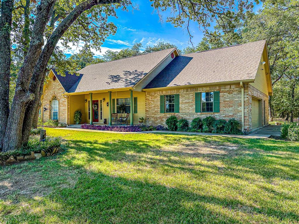 This stunning 3 bed, 3 bath home is situated on over 3 acres of land on a quiet cul-de-sac providing ample space and privacy. The property features an attached garage for convenient parking, as well as a separate garage that could be used for housing a boat. Inside the home, you'll find spacious and well-appointed bedrooms. This is a dream property for those looking for space, privacy and the ability to enjoy outdoor activities. Within walking distance to Richland Chambers Lake, and 15 minutes to Corsicana this is a perfect retreat. Don't miss out on this incredible opportunity to own a truly exceptional home.