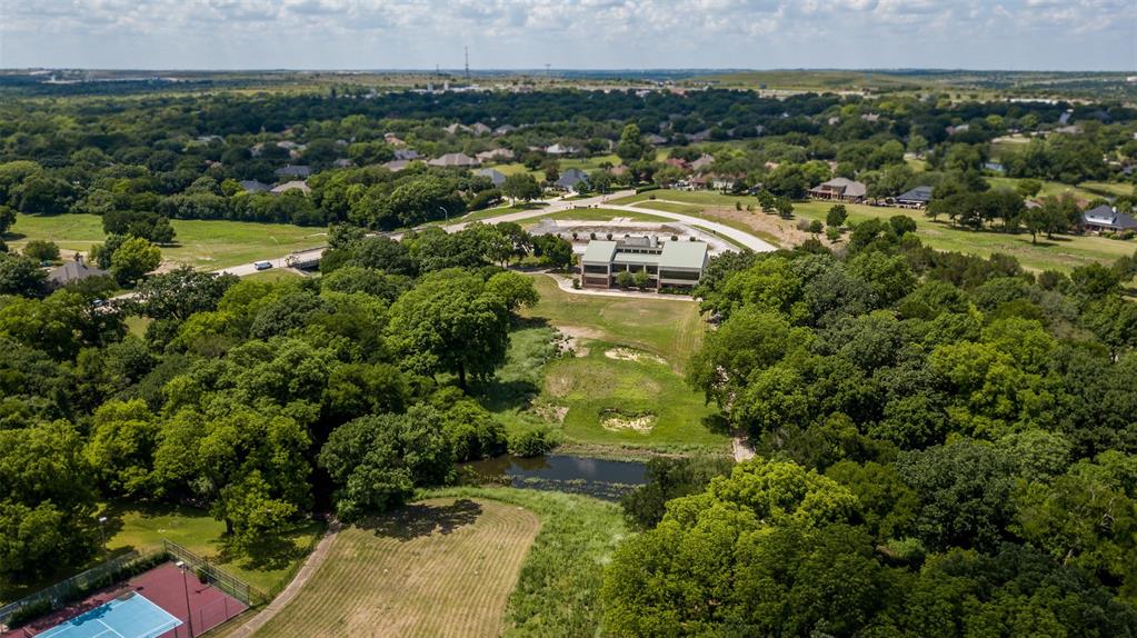 Rare Development opportunity in growing West Ft Worth Corridor. 151 plus acres in Lost Creek. Former golf course, but perfect for building in this highly sought after area. Rolling terrain with huge, beautiful trees in established neighborhood. Great location with easy access to highways, shopping, Walsh Ranch and easy commute to downtown.  Existing clubhouse and surrounding area is zoned commercial.  Remaider is zoned residential.