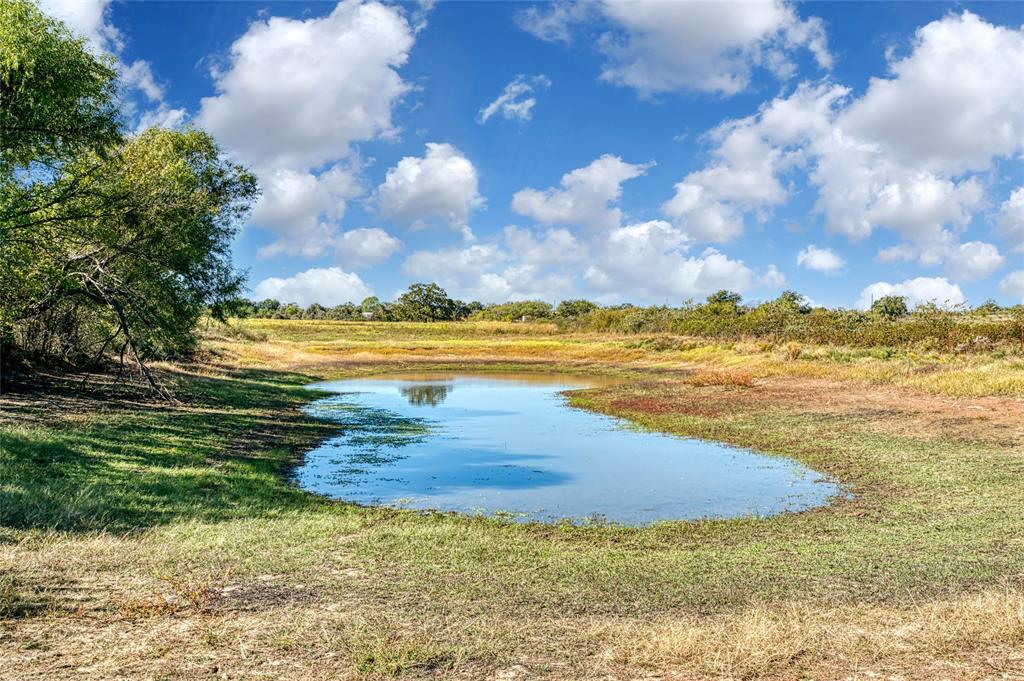 Escape the city and embrace unlimited possibilities on this 4.79 acres with a pond. There is ample room for gardening, a workshop or a few cattle. You can build a dream home or bring your mobile home. Light deed Restrictions. Will work with your mobile home dealer in a land package deal.